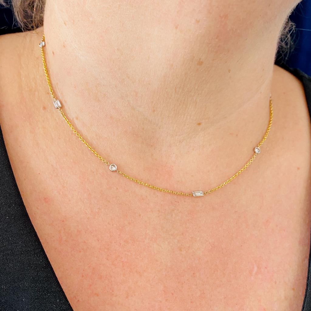 This diamond by the yard necklace has seven gorgeous diamonds. The alternating diamond baguettes and round diamonds are set in white gold bezels to emphasize the bright high color of the diamonds. The bezel set diamond stations are evenly spaced
