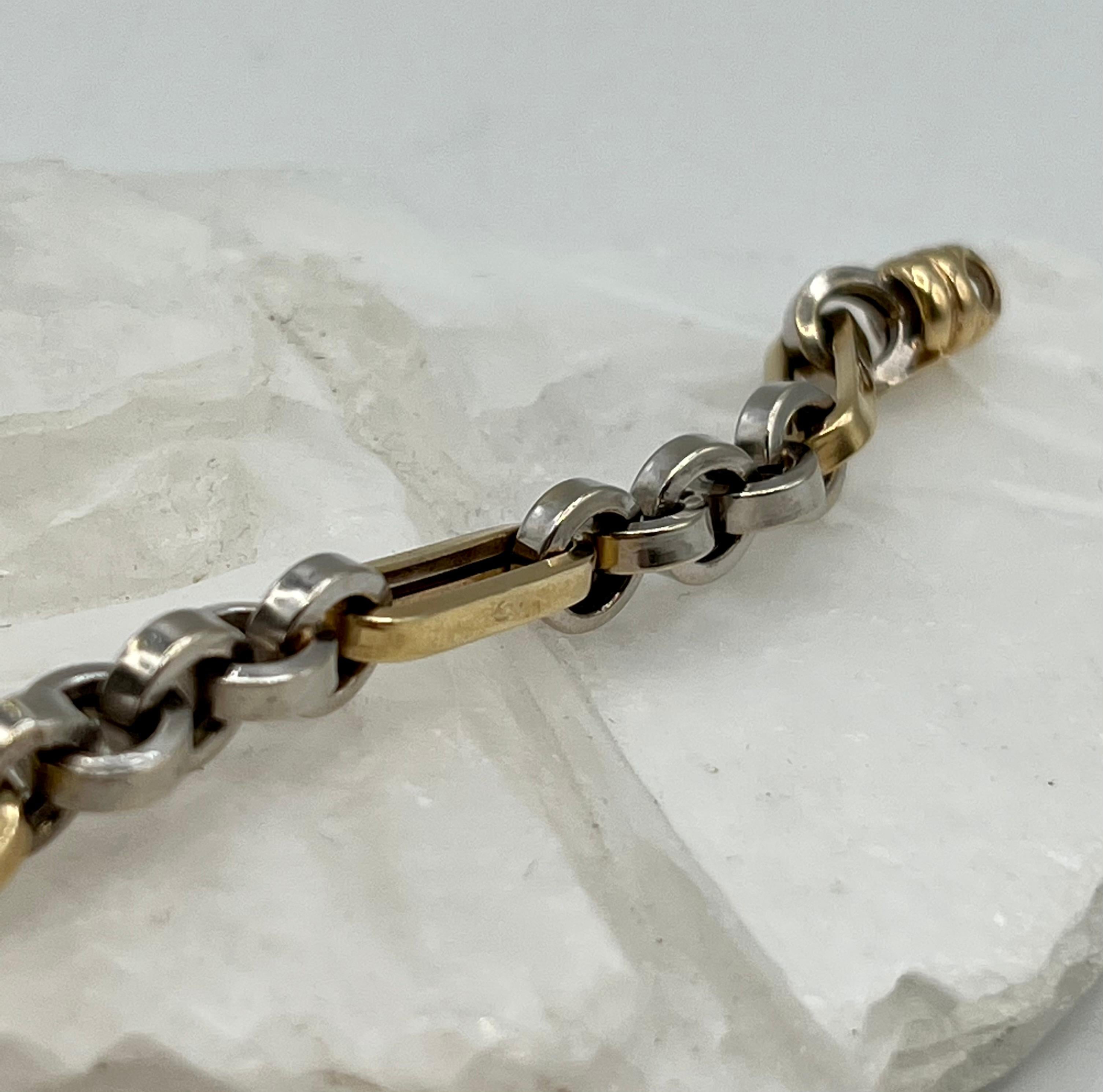 This chunky two tone bracelet can be worn with other bracelets or a watch for a layered look.
 The yellow gold elongated links with the white gold round links is a beautiful contrast.