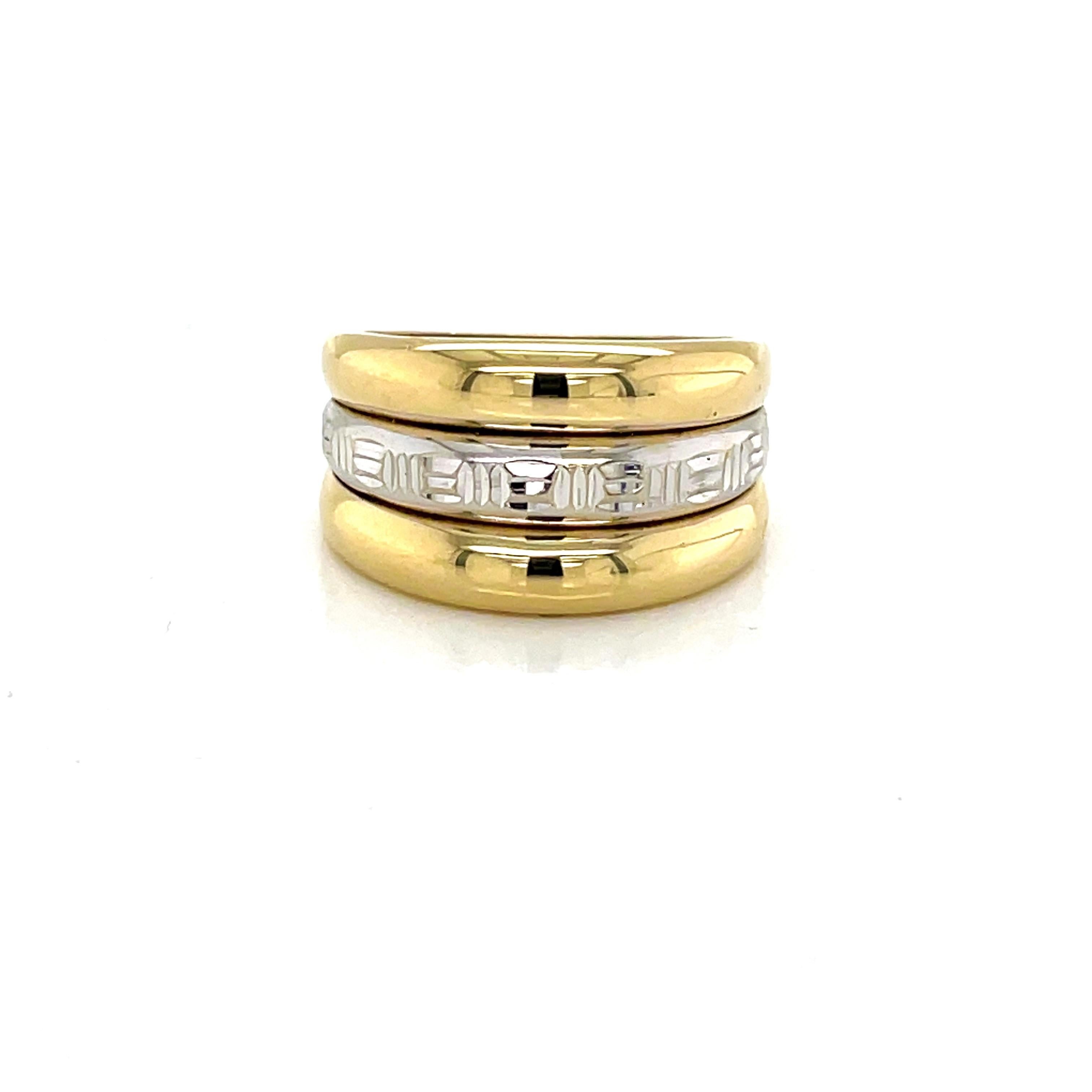 With both fourteen karat 14K white gold and fourteen karat 14K yellow gold, this versatile band offers contemporary style and comfort for everyday wear. Measuring 11.8mm in width at its face and gently tapering back to 5.5mm, the ring's white gold