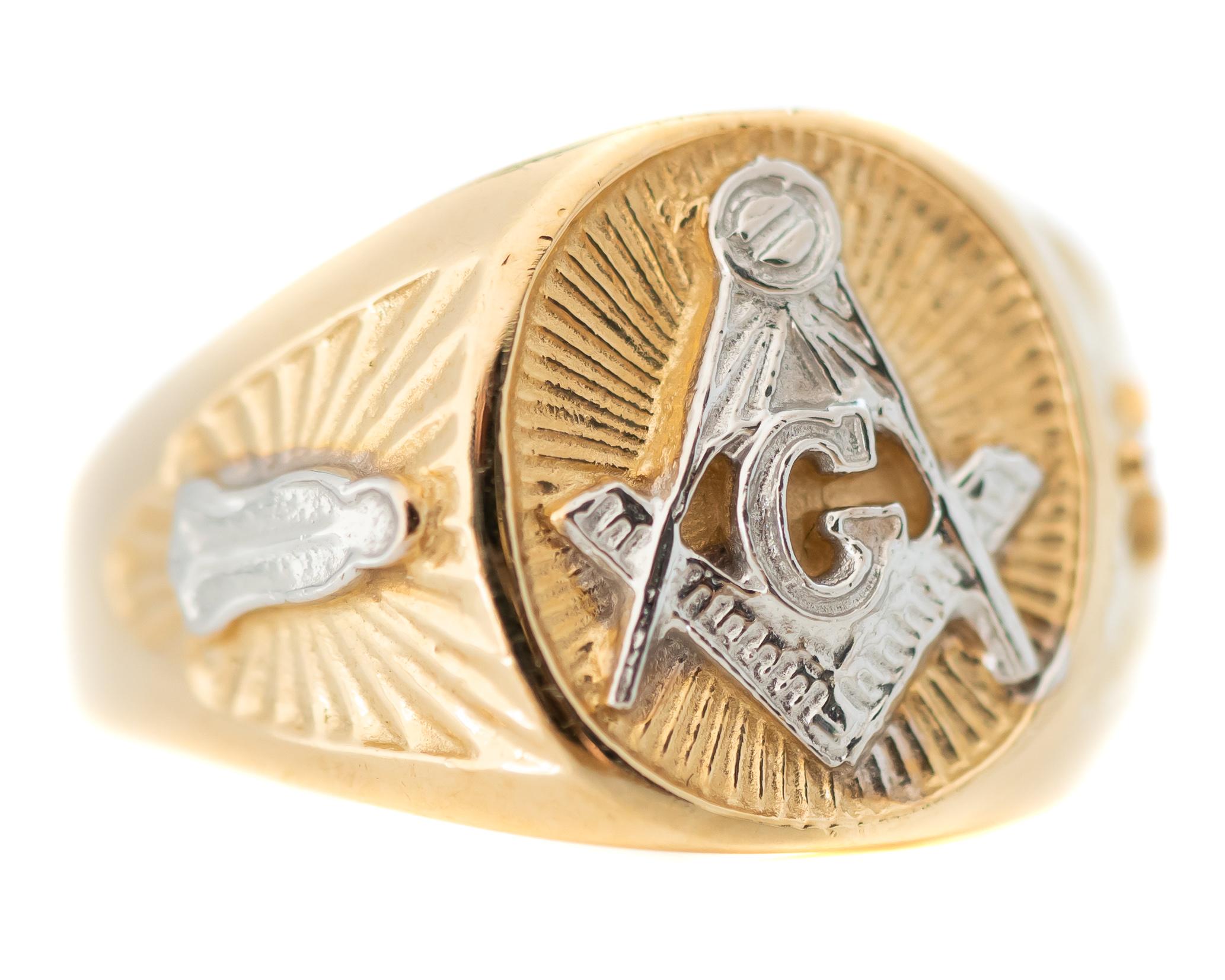 Masonic Ring - 14 Karat Yellow Gold, White Gold

Features: 
14 Karat Yellow gold Ring
14 Karat White gold Design on Front and Shoulders
Mason motif
Band width tapers from 15 - 4 millimeters
Ring fits a size 10, can be resized

Item Details: 
Ring