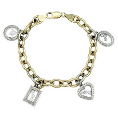 Two-Tone 14 Karat Gold Oval Link Multi-Charm Bracelet with Floating Diamonds