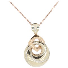 Two-Tone 18 Karat Diamond Swirl Pendant Two-Tone 18 Karat Diamond Swirl Pendant