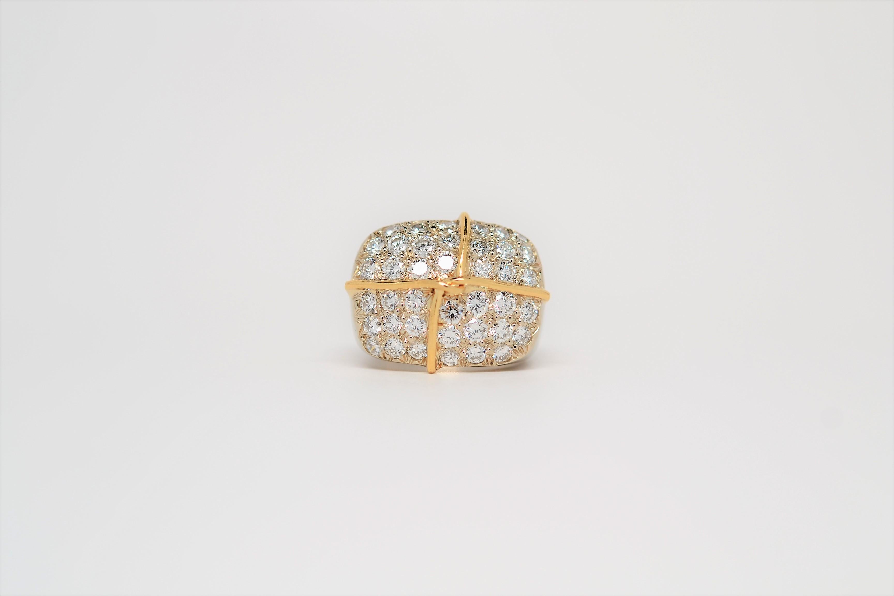 A custom ring made in 18K Two Tone with Yellow & White Gold and a layout of Pavé set Round Brilliant Cut Diamonds. 
Forty Round Brilliant Cut Diamonds weigh 2.64ct, diamond color grade range is F to G and clarity grade range is VS-1 to VS-2.
The