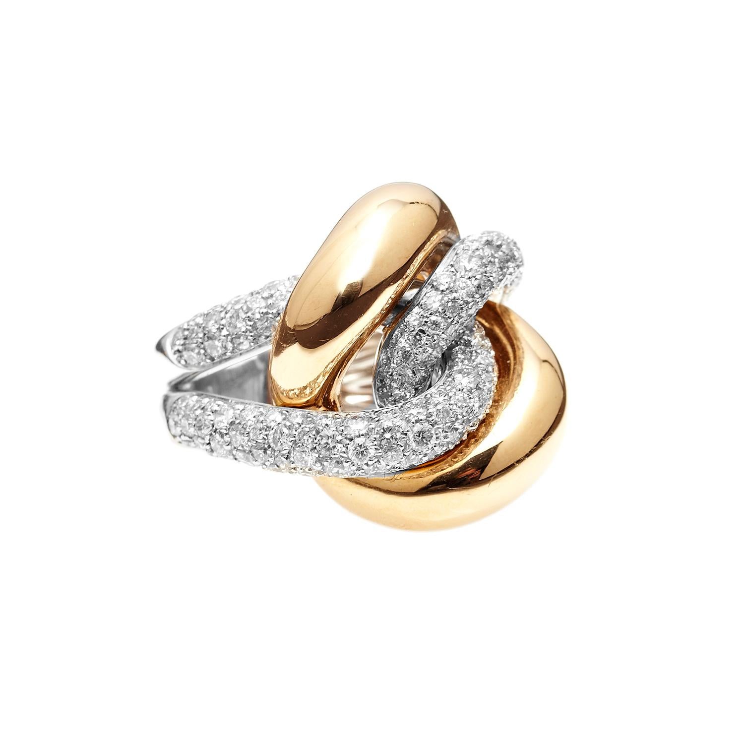 This stunning piece has amazing flowing lines with diamond interlocking and really special use of two gold tones. Its not for the faint of heart, featuring 3.3ct of diamonds and almost 30 grams of 18kt gold.