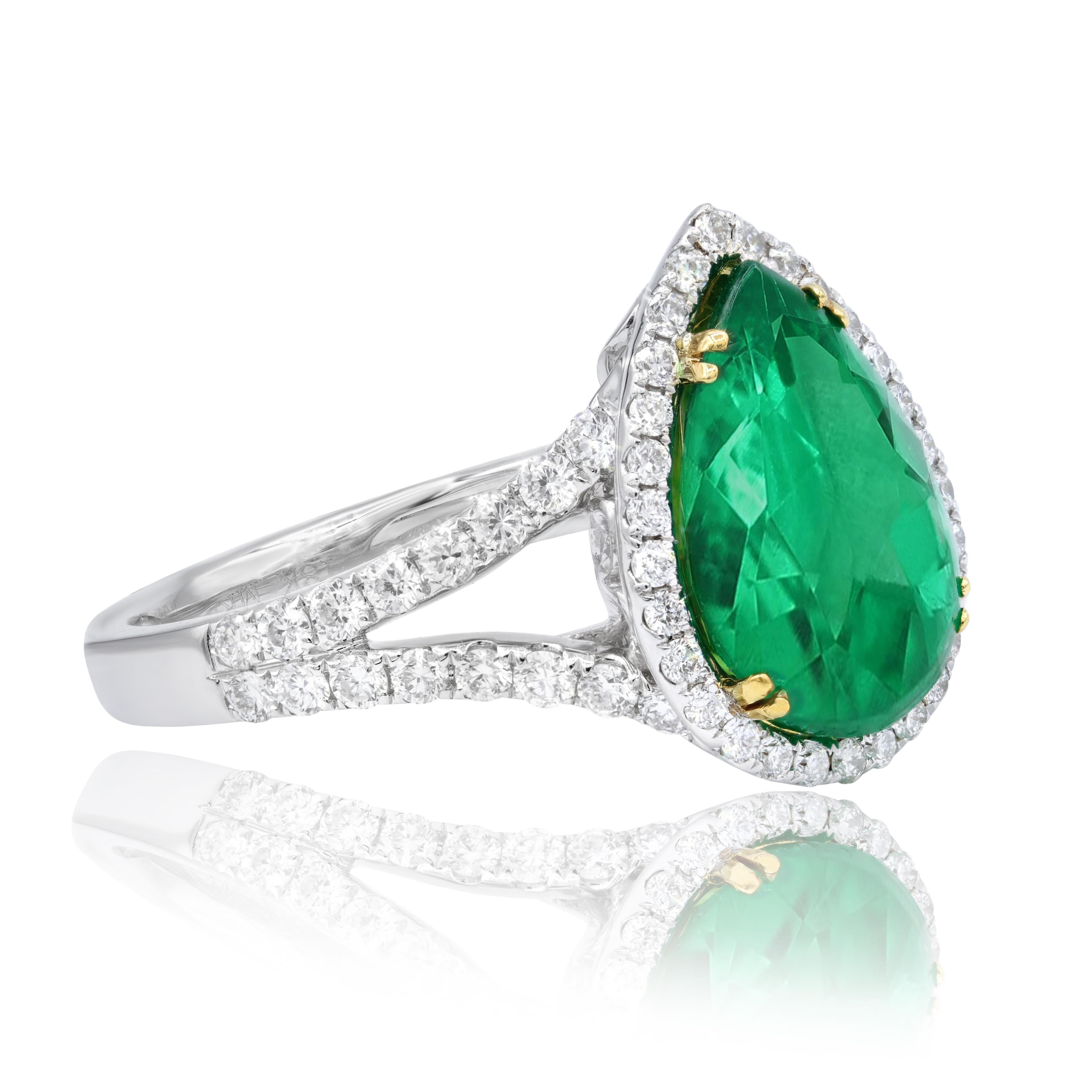 18KT two tone ring features 3.79 ct of pear shape emerald and 0.79 cts of white round diamonds in a halo set in a split shank setting.
Can be resized to any finger size.

This product comes with a certificate of appraisal
This product will be