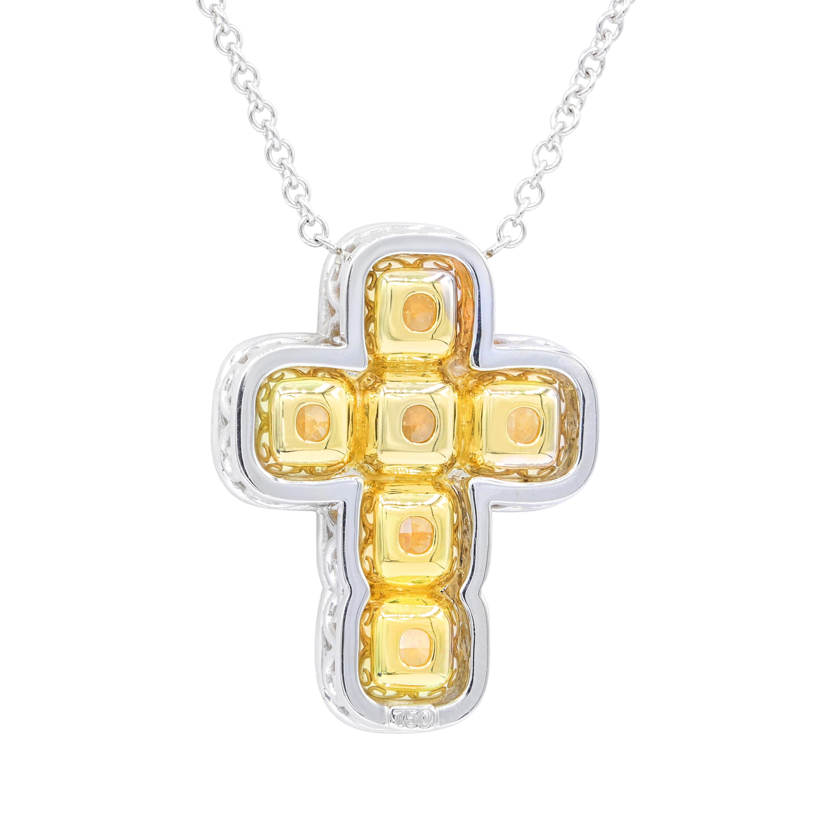 18KT two tone diamond cross pendant features 6.10ct of 6 yellow cushion diamonds in white diamond halo of 0.50cts