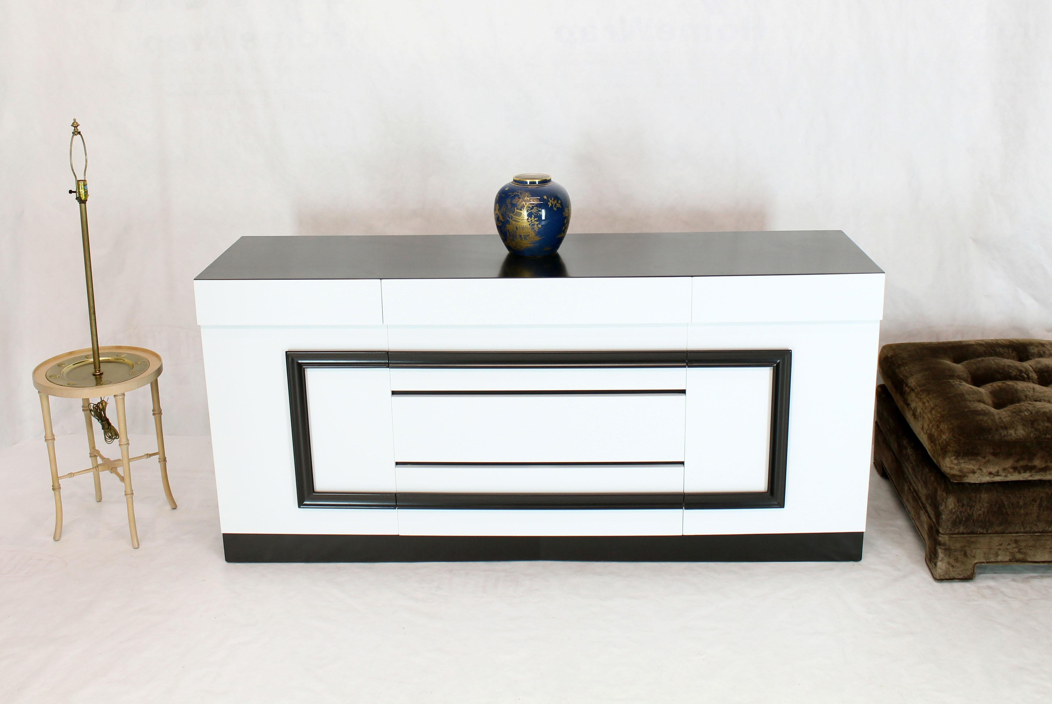 Mid-Century Modern black and white lacquer dresser attributed to James Mont. Greek key style pulls.