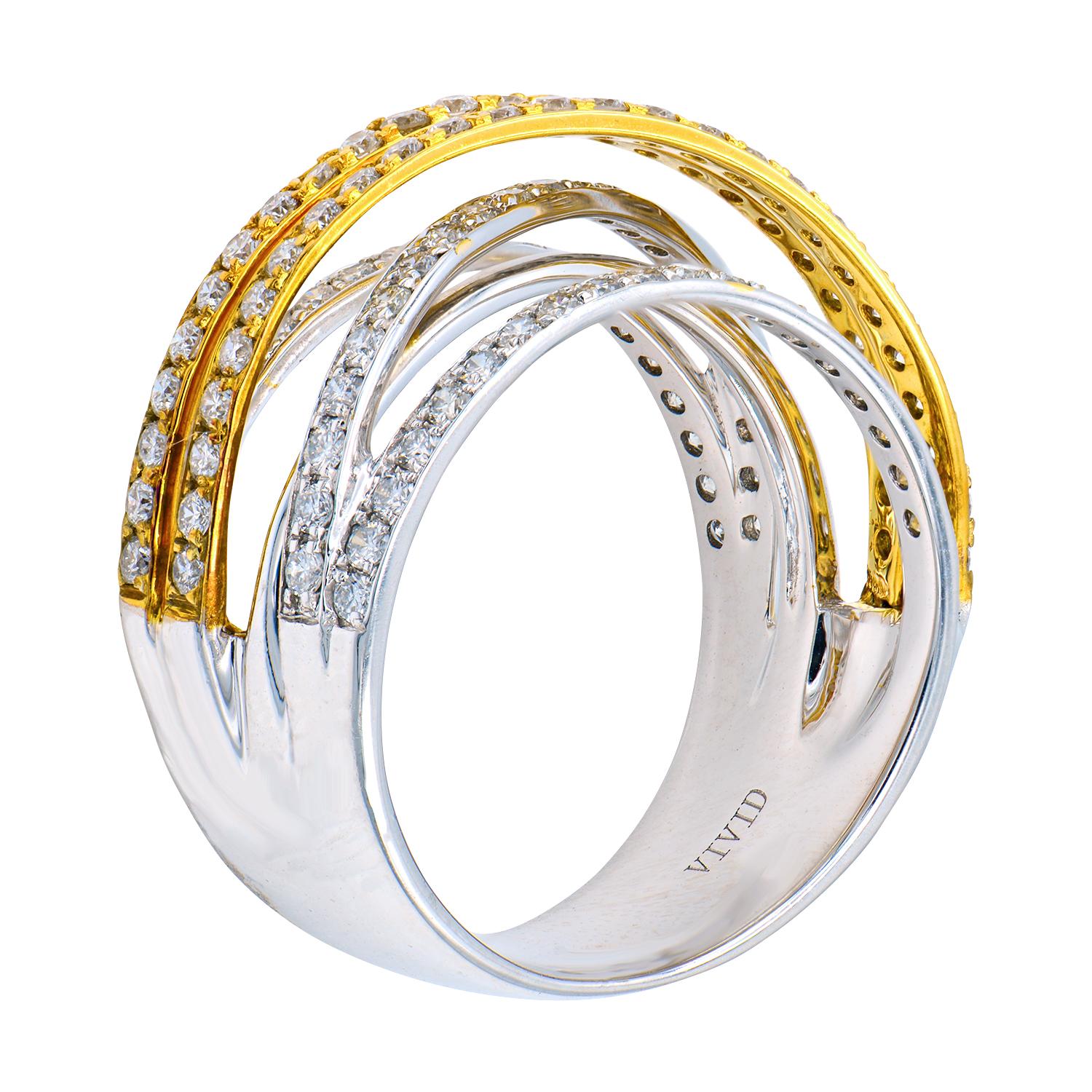 This two toned ring is made from 18 karat white and yellow gold. The bands with yellow gold and diamonds cross on top of the bands with white gold and diamonds. There are 112 round VS2, G color diamonds that total 1 carat which are set in 7.6 grams