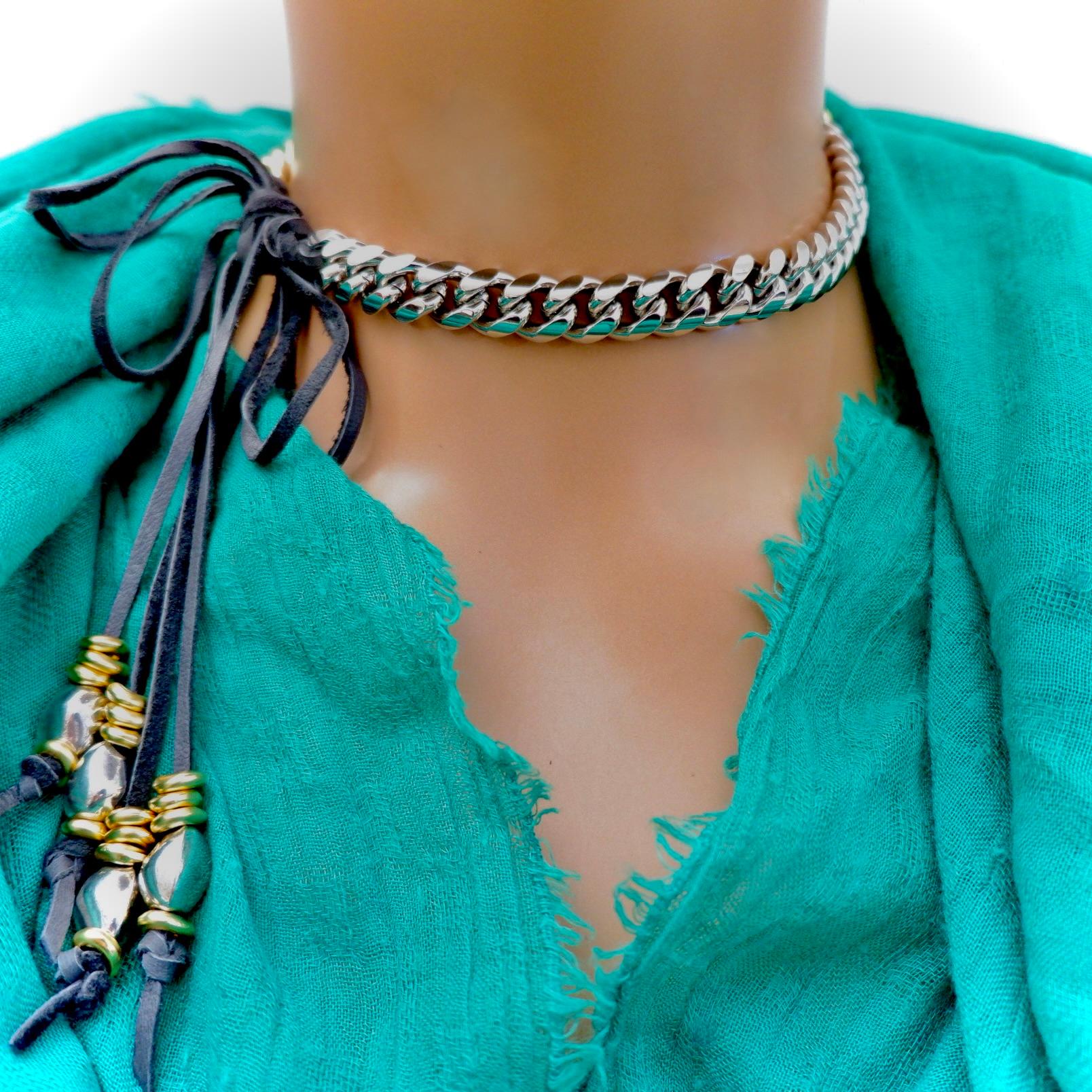 Introducing a handcrafted choker necklace that seamlessly blends sophistication with modern flair. This one-of-a-kind piece features a beautifully heavy-weight two-tone gold-plated chain, with half of the chain in elegant silver and the other half