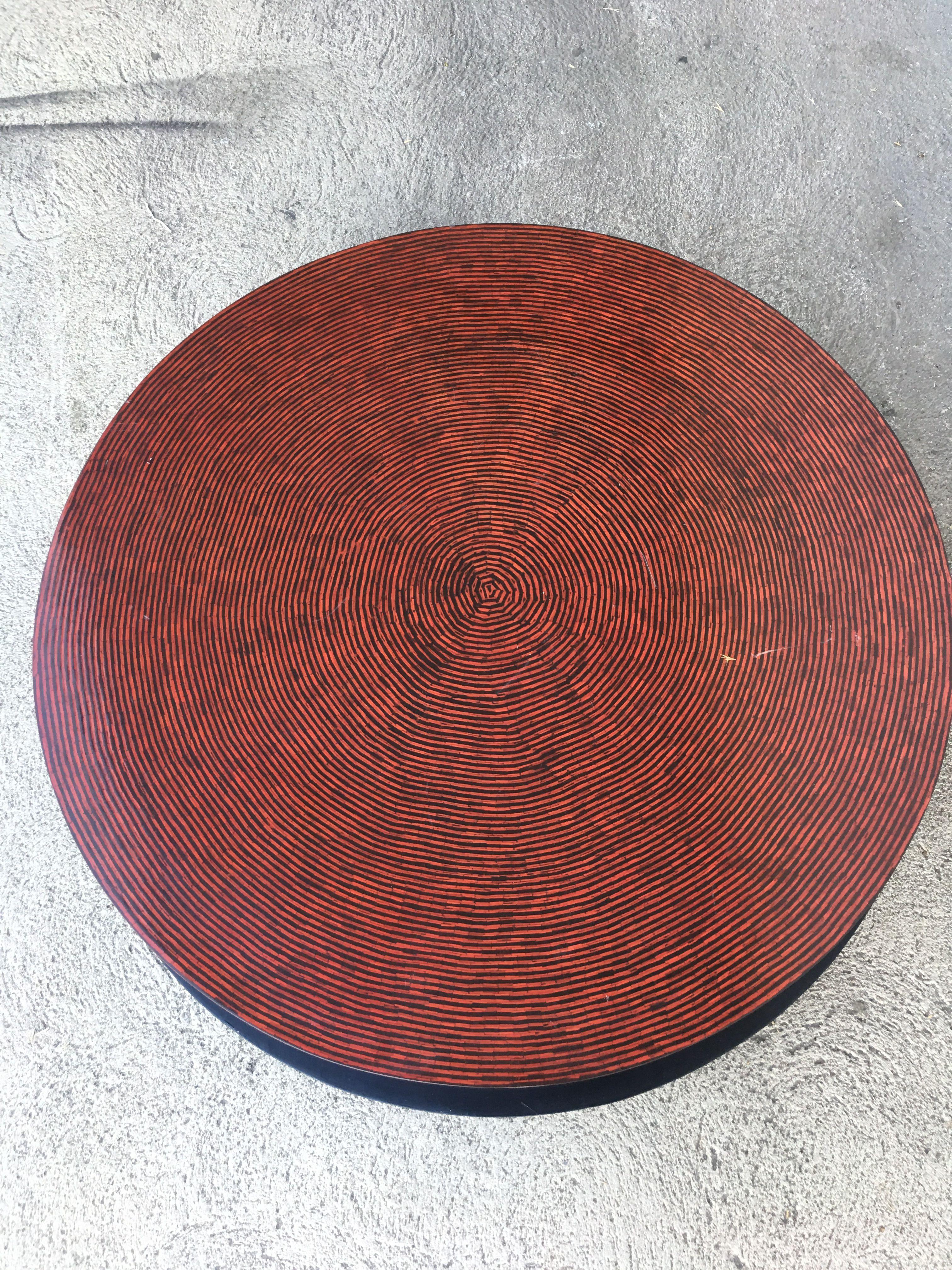 Two-tone Cubist Style round Coffee/Cocktail table with black base and red textured vinyl top. Matching side tables available search 