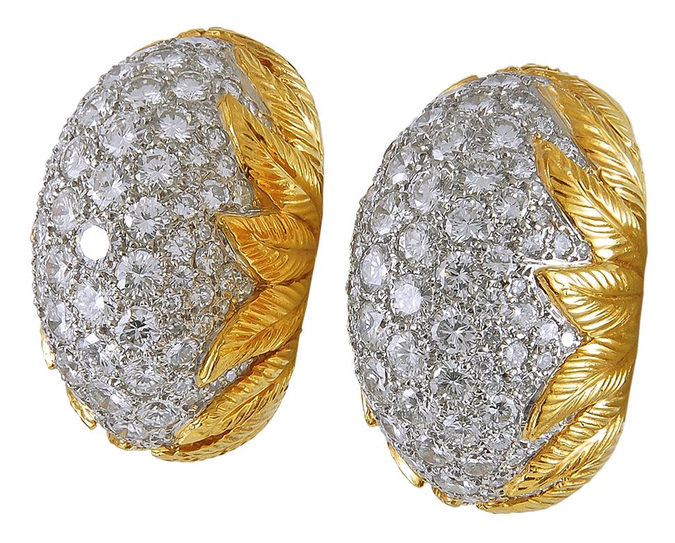 Diamond Pod Bombe Earrings in Platinum and 18k Yellow Gold.

A pair of two-toned metal and diamond earrings in the bombé domed style in the glamourous Hollywood Regency style. White diamond pavé is impeccably set into lightweight platinum pods and