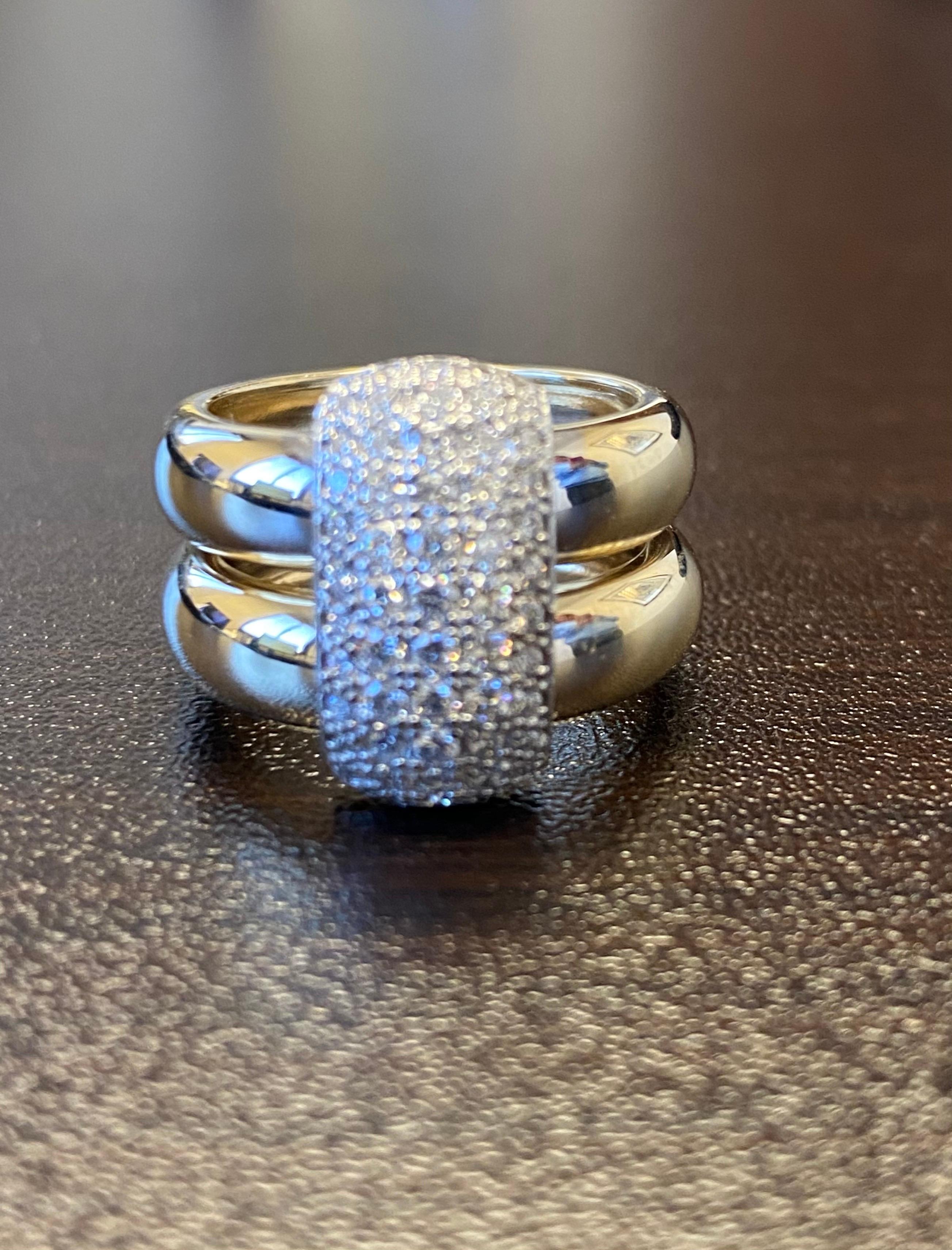 Diamond ring set in 14K white and yellow gold. The ring is set in a pave' setting, the total carat weight is 0.90 carats. The color of the stones are G, the clarity is SI1. The ring is a size 6.5.