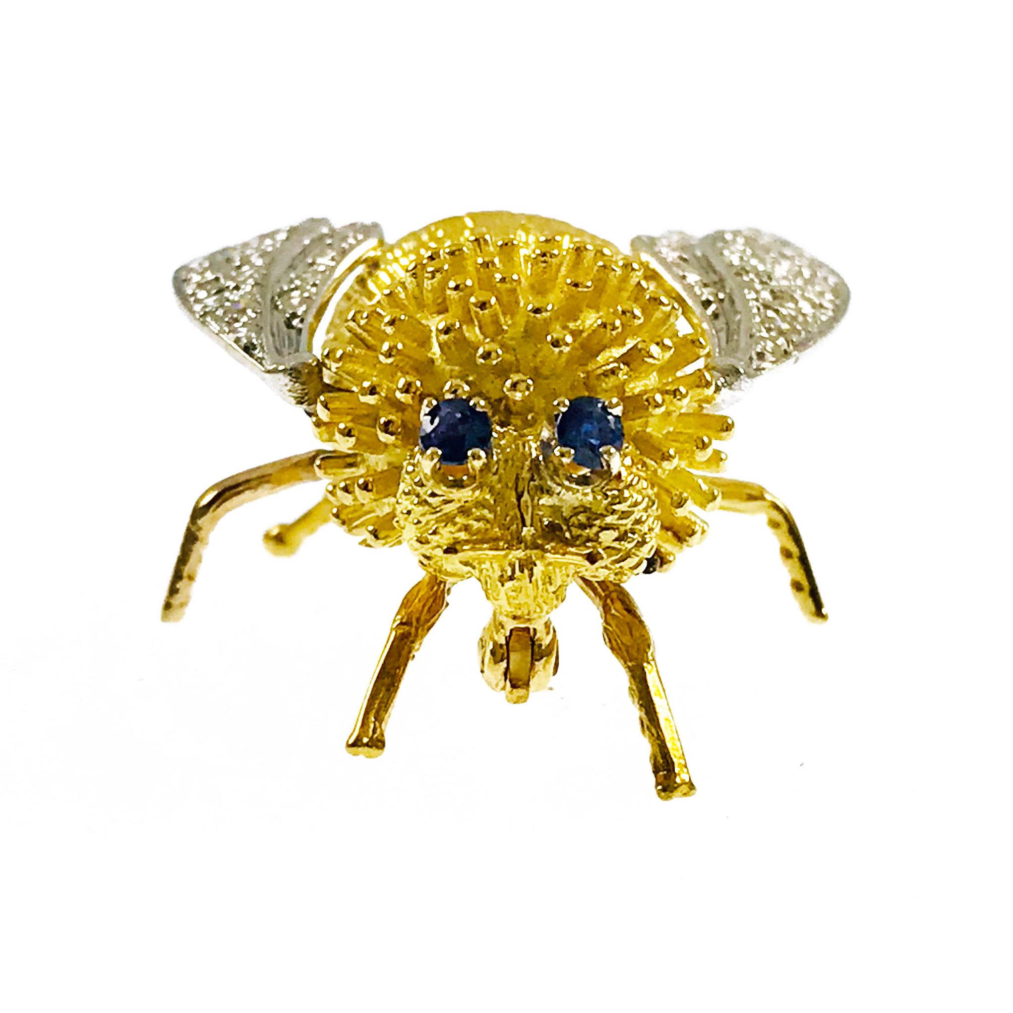 18k Gold Two-Tone Diamond Sapphire Bee Fly Brooch. There is fine textured detail in the body and in the outspread wings. Fifty-three round 1.35mm single cut diamonds adorn the wings. Diamonds are VS (G.I.A.) in clarity and G-H (G.I.A.) in color with