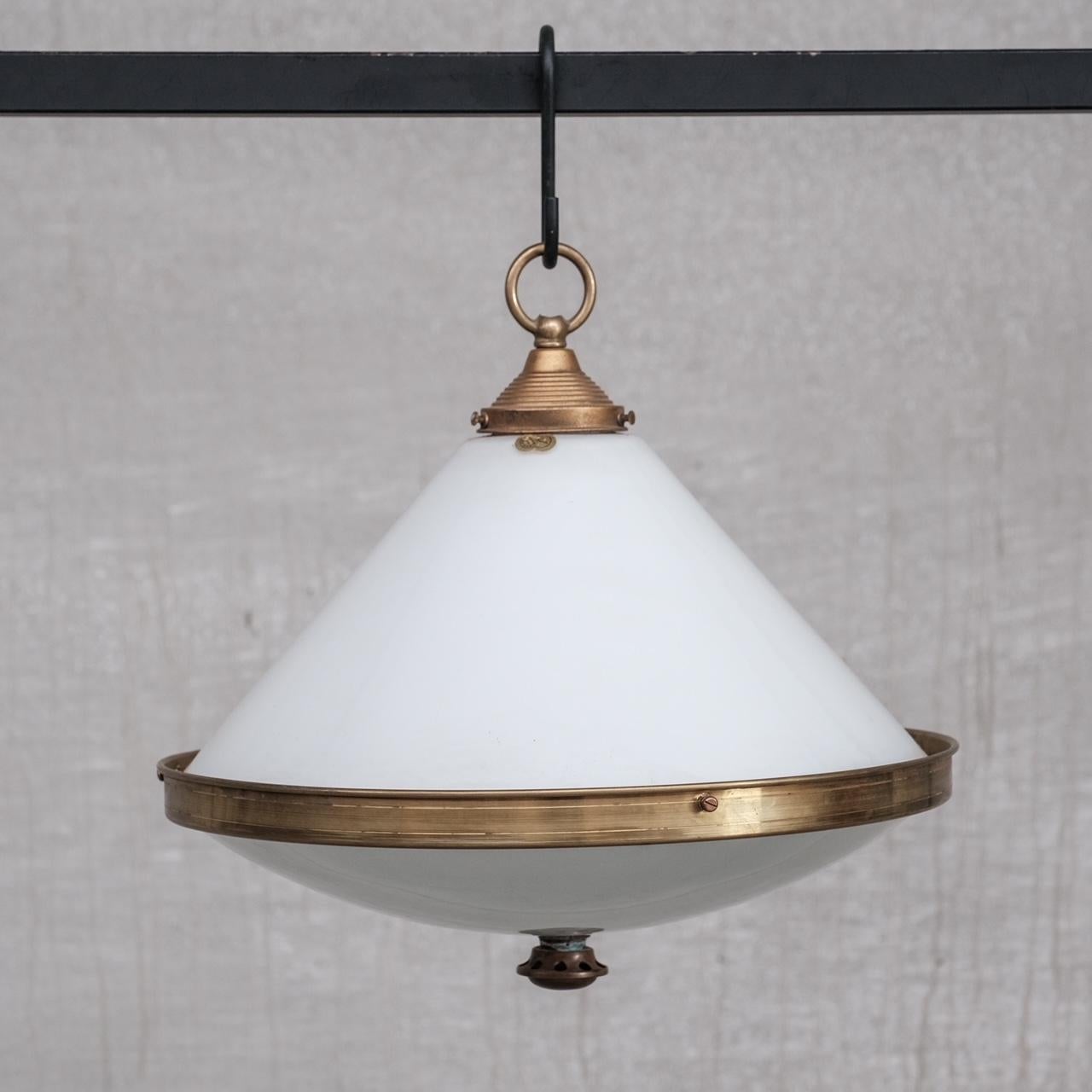 An antique two tone pendant light. 

France, c1930s.

Opaline top glass, a greyer etched base, brass rim and gallery, the ligh terminates with a brass finial to the base. 

Since re-wired and PAT tested. 

No chain or rose were retained with