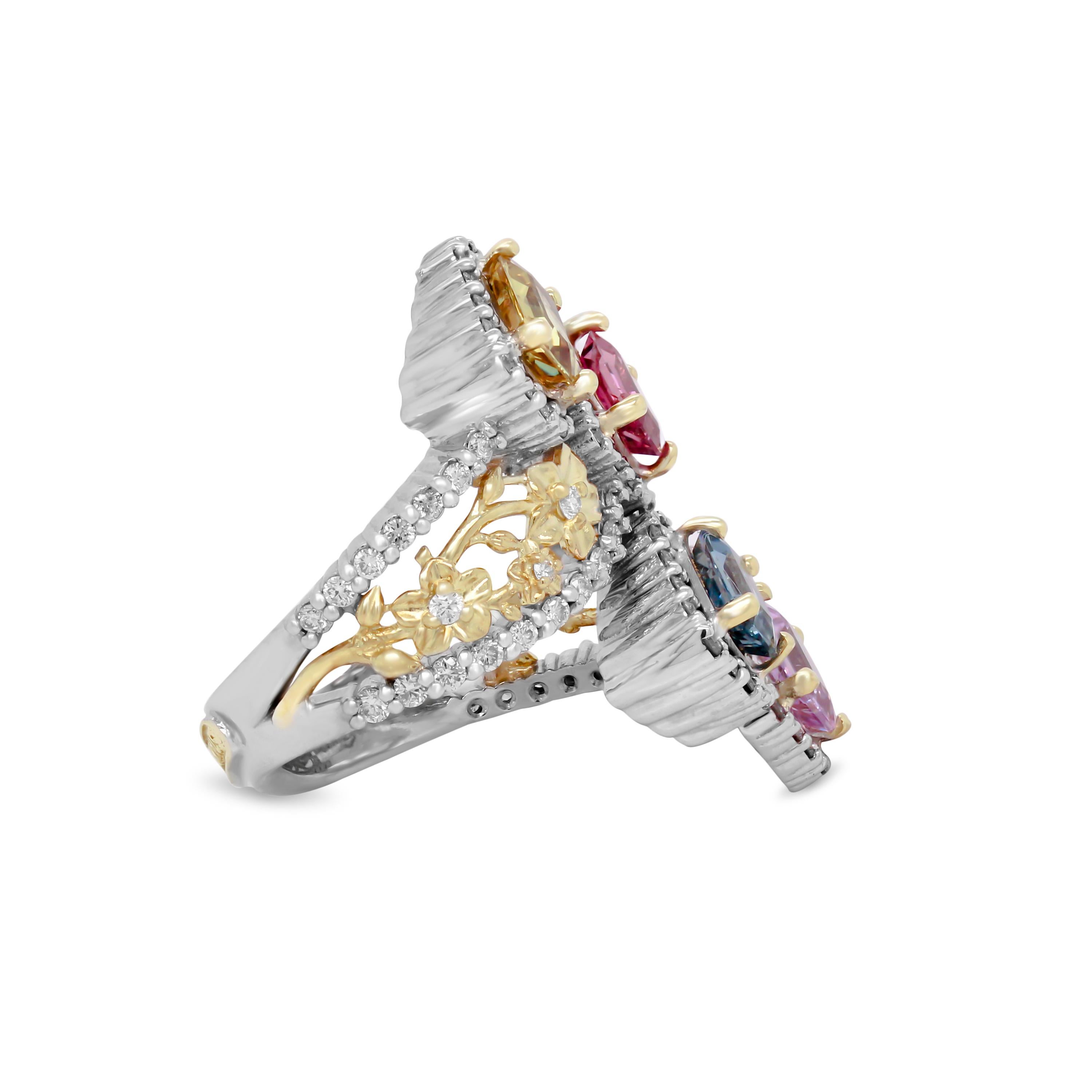 Stambolian 18K Yellow White Gold Floral Diamonds Emerald Cut Sapphires Ring

This one-of-a-kind bypass ring features an incredible floral design on both sides of the band with diamonds set on both edges. The center of the ring features four,