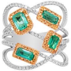 Spiralring aus zweifarbigem Gold und gelb-weißen Diamanten mit Smaragden