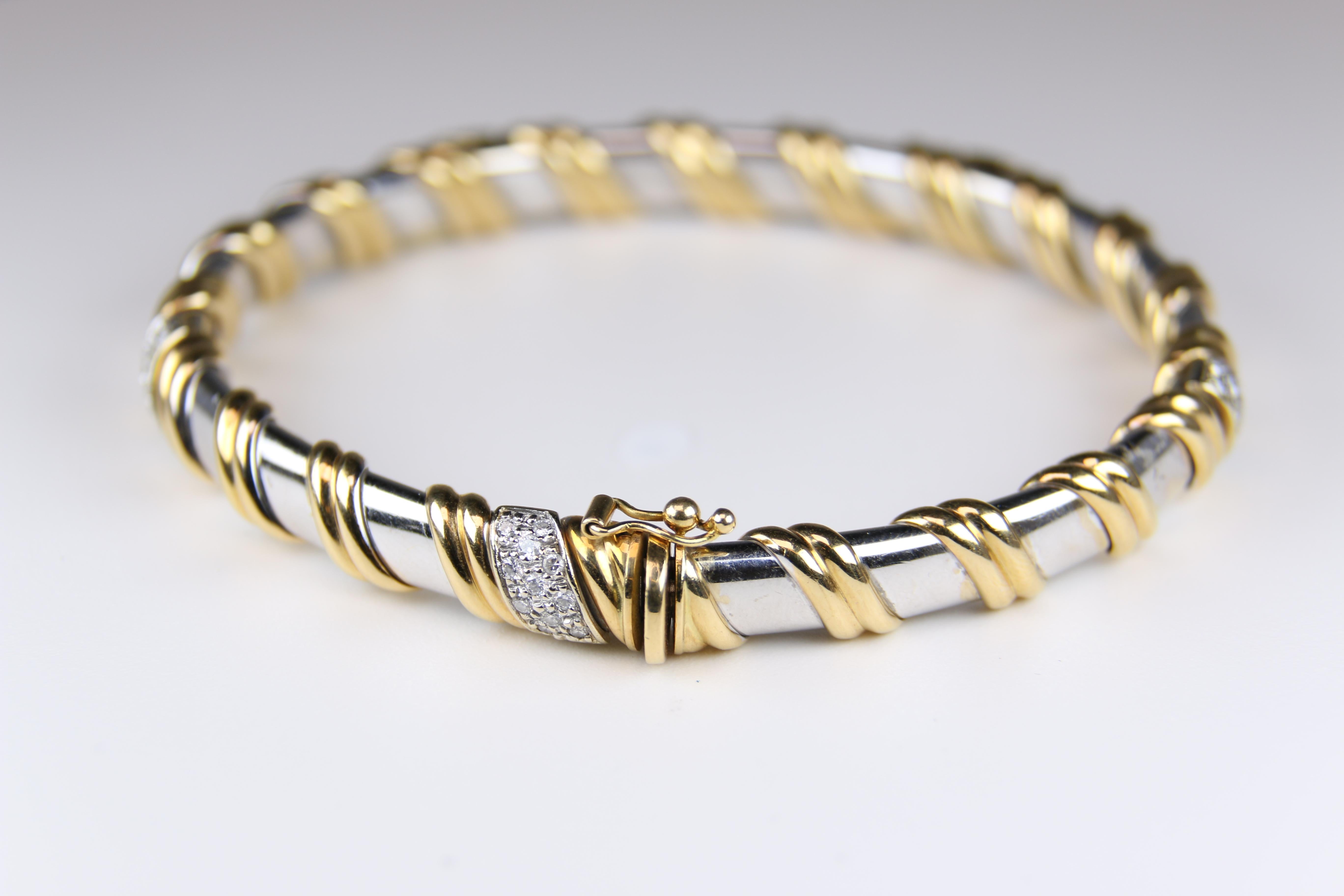 Two tone gold diamond bangle.  White and Yellow Gold.  Classic look. 