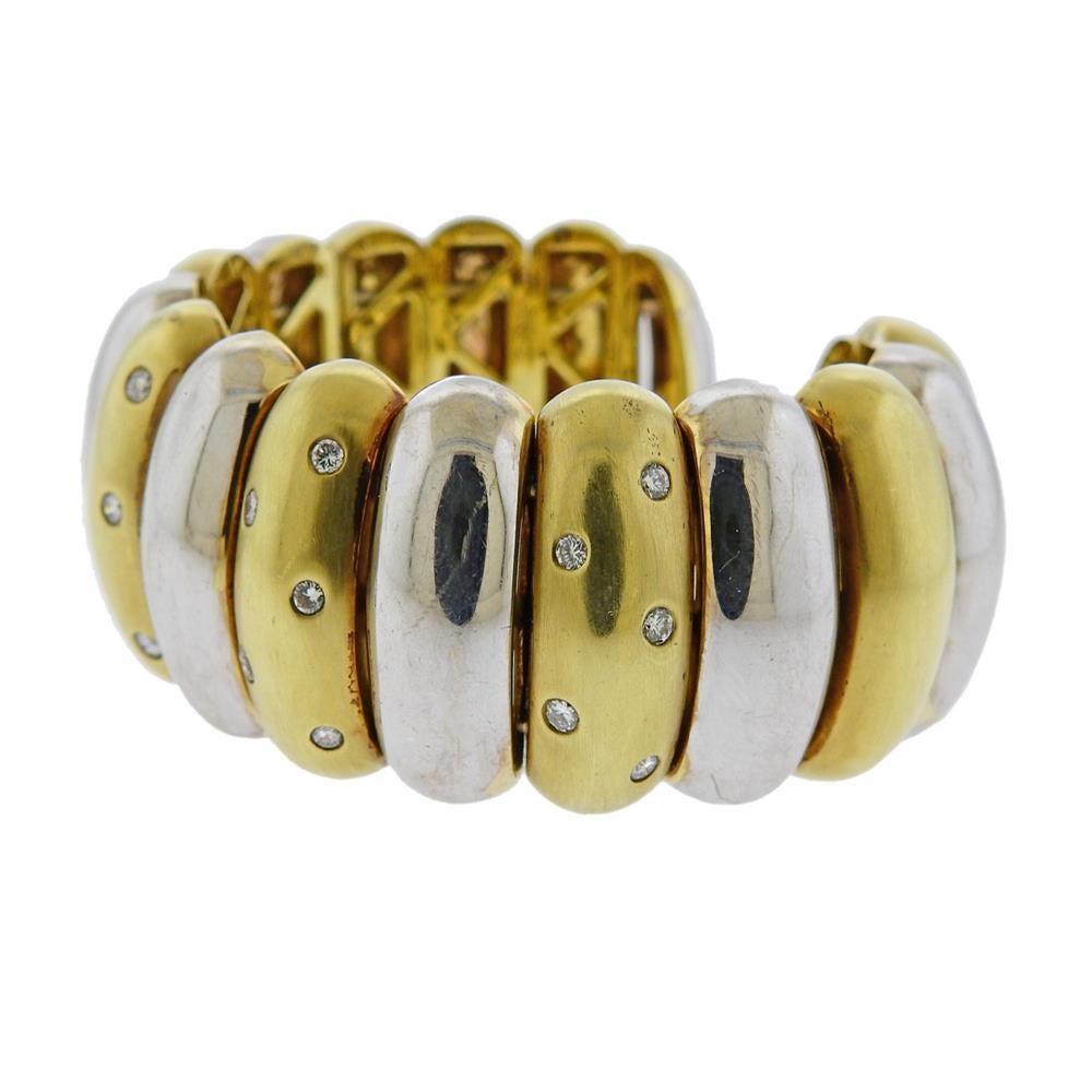 18k white and yellow gold cuff bracelet, set with approx. 1.00ctw in diamonds. Cuff will fit approx. 7