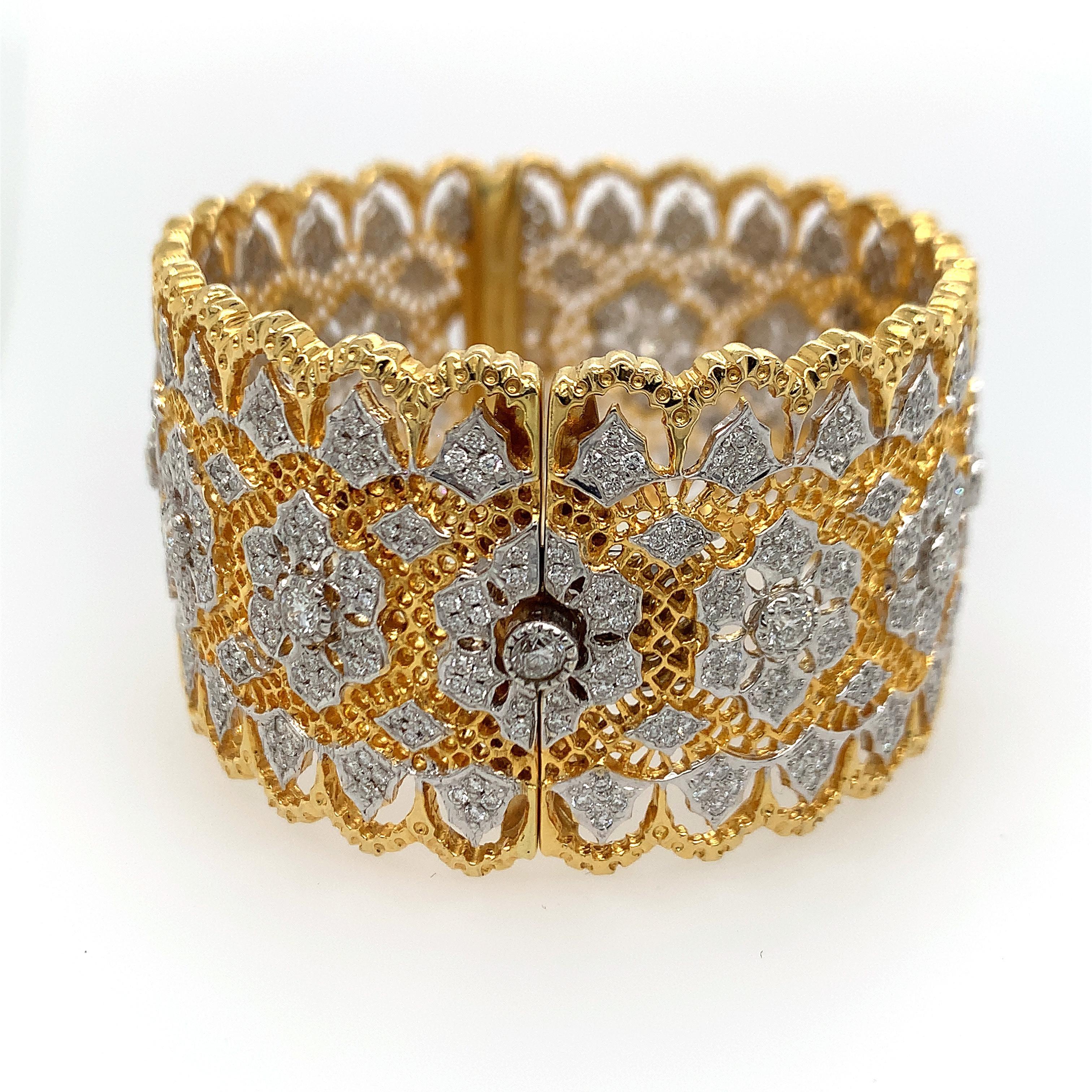 18K two tone gold bangle, stamps K18 D 3.13, RBC diamonds weighing 3.13 ct (inscribed) GH VS, measures 6 1/2 inches inner circumference, 1 1/4 width, weight 52.8 dwt. 