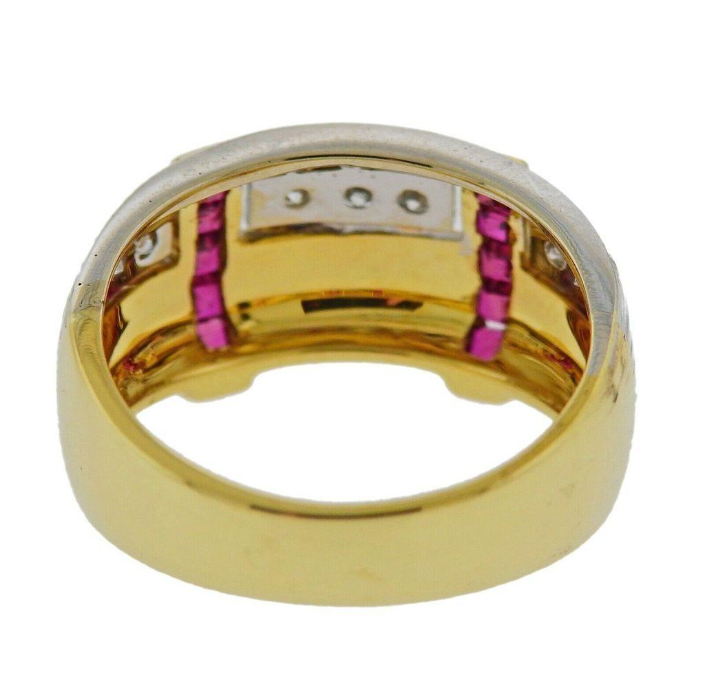 18k two color gold ring with rubies and approx. 0.18ctw in H/SI1 diamonds. Ring size 7.25, Ring top is 10mm wide. Total weight 6.6 grams. Marked 750, Italian mark.