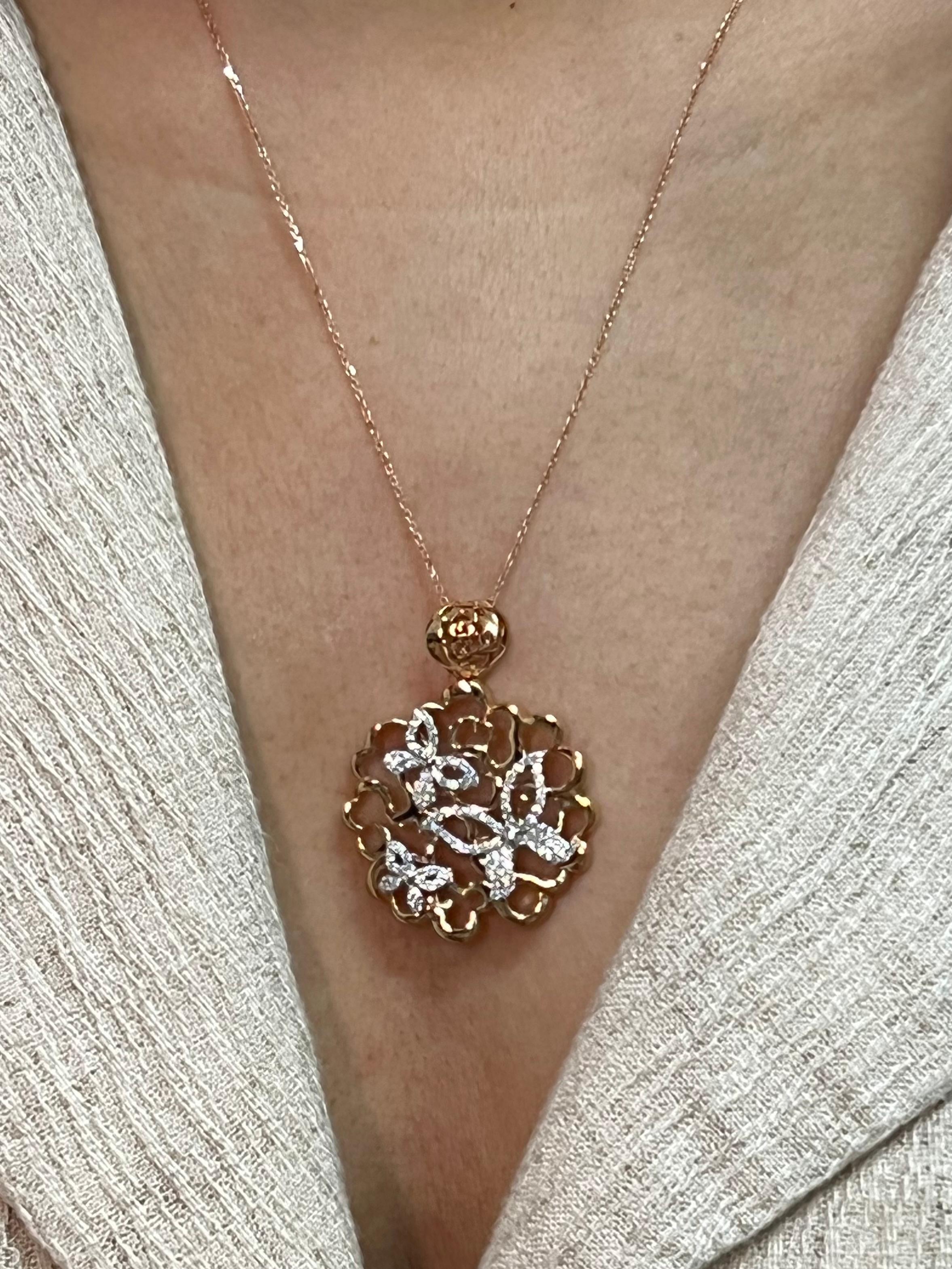 Please check out the HD video. This pendant has a 3D look with an excellent depth of field. It looks like 3 butterflies floating on clouds. There are 100 diamonds totaling 0.55cts used in this rose and white gold setting. An 18k rose gold chain will