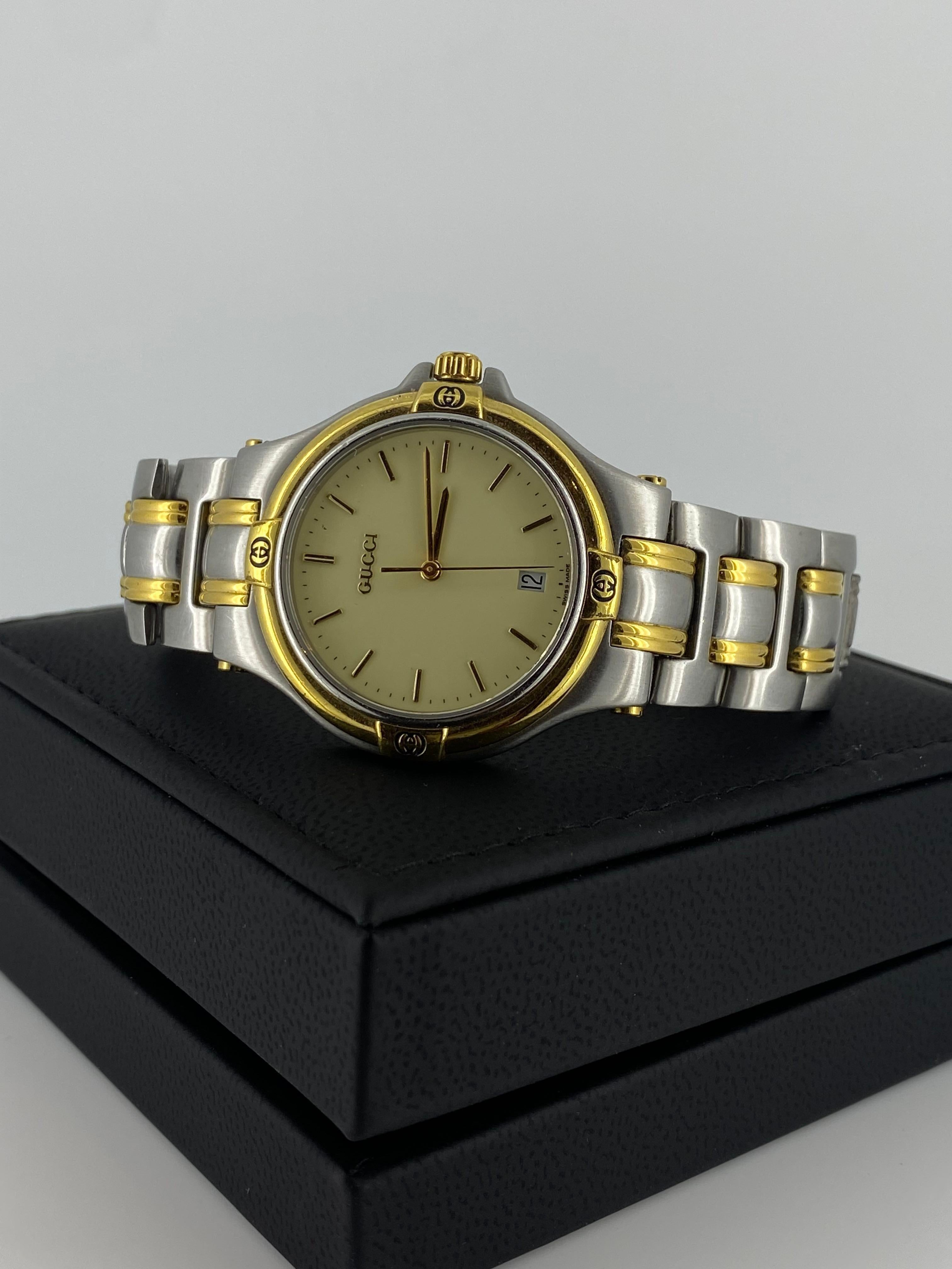 This Two-Tone elegant Gucci wristwatch
features a 36mm stainless steel case, 
3ATM water-resistant, 
with striking logo-adorned golden bezel &
signed crown 

Sturdy stainless steel bracelet features gold accents, 
hidden butterfly signed clasp &