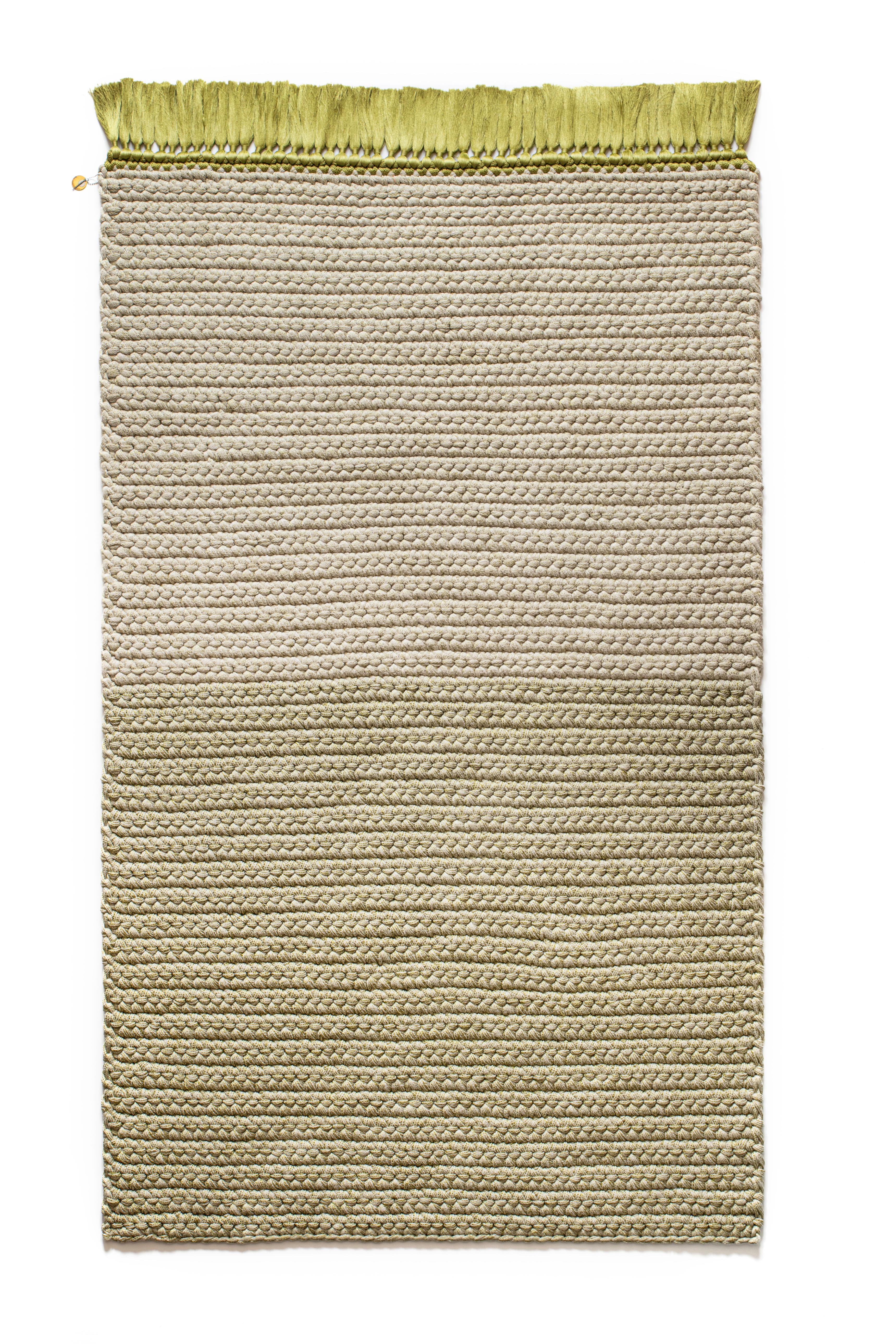 A two-tone green and stone gradient rug that will light up any space, suitable for an intimate corner in the living space as well as for bedrooms, corridors and passages. This rug is 100% hand knit out of one continuous, color changing, soft machine