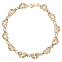Pulsera Corazón y Cruz Bicolor en Oro de 14K