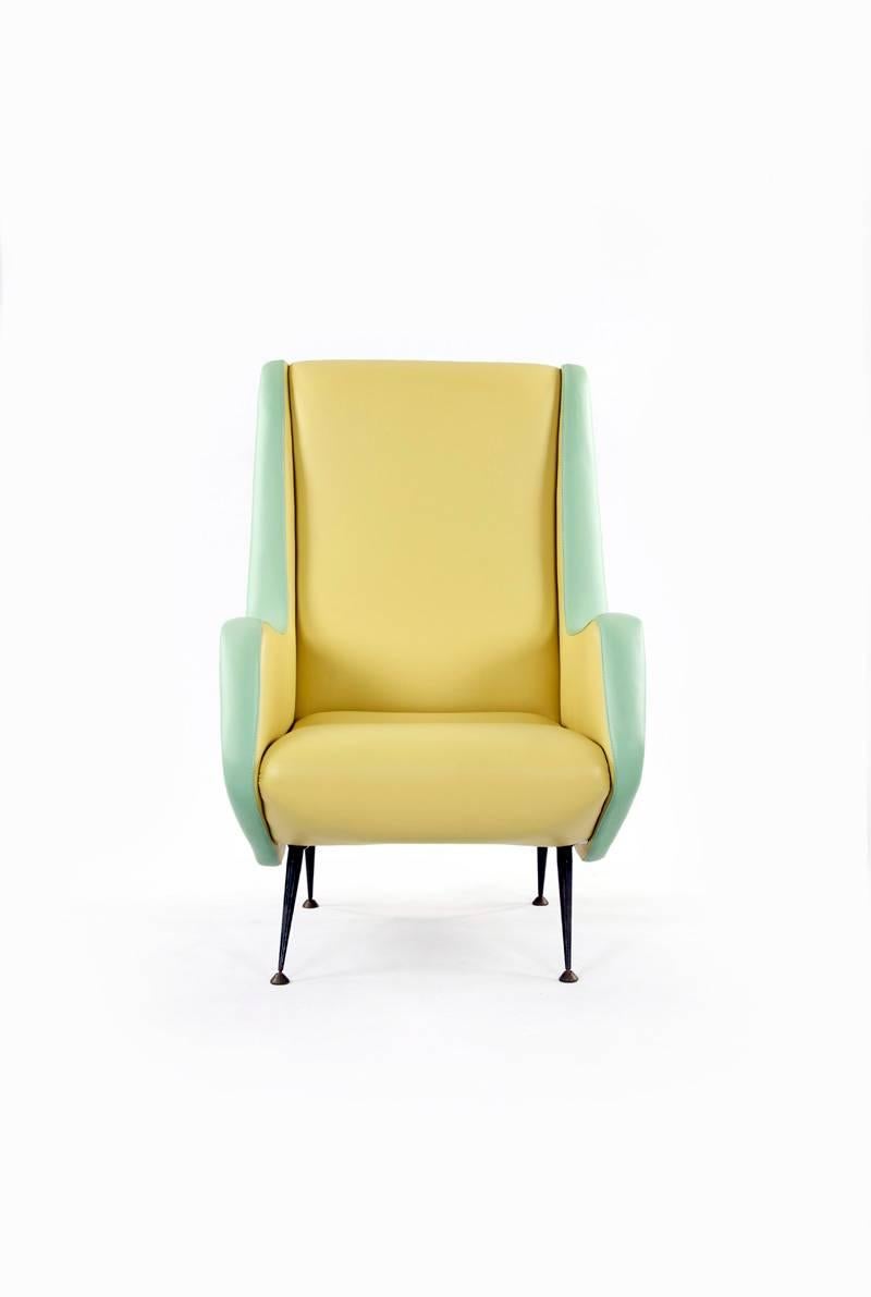Chair designed by Aldo Morbelli for I.S.A. Bergamo, 1950s. Reupholstered with a genuine two-tone leather cover, while retaining original varnished legs and brass feet. Color selection inspired by the original model.

  