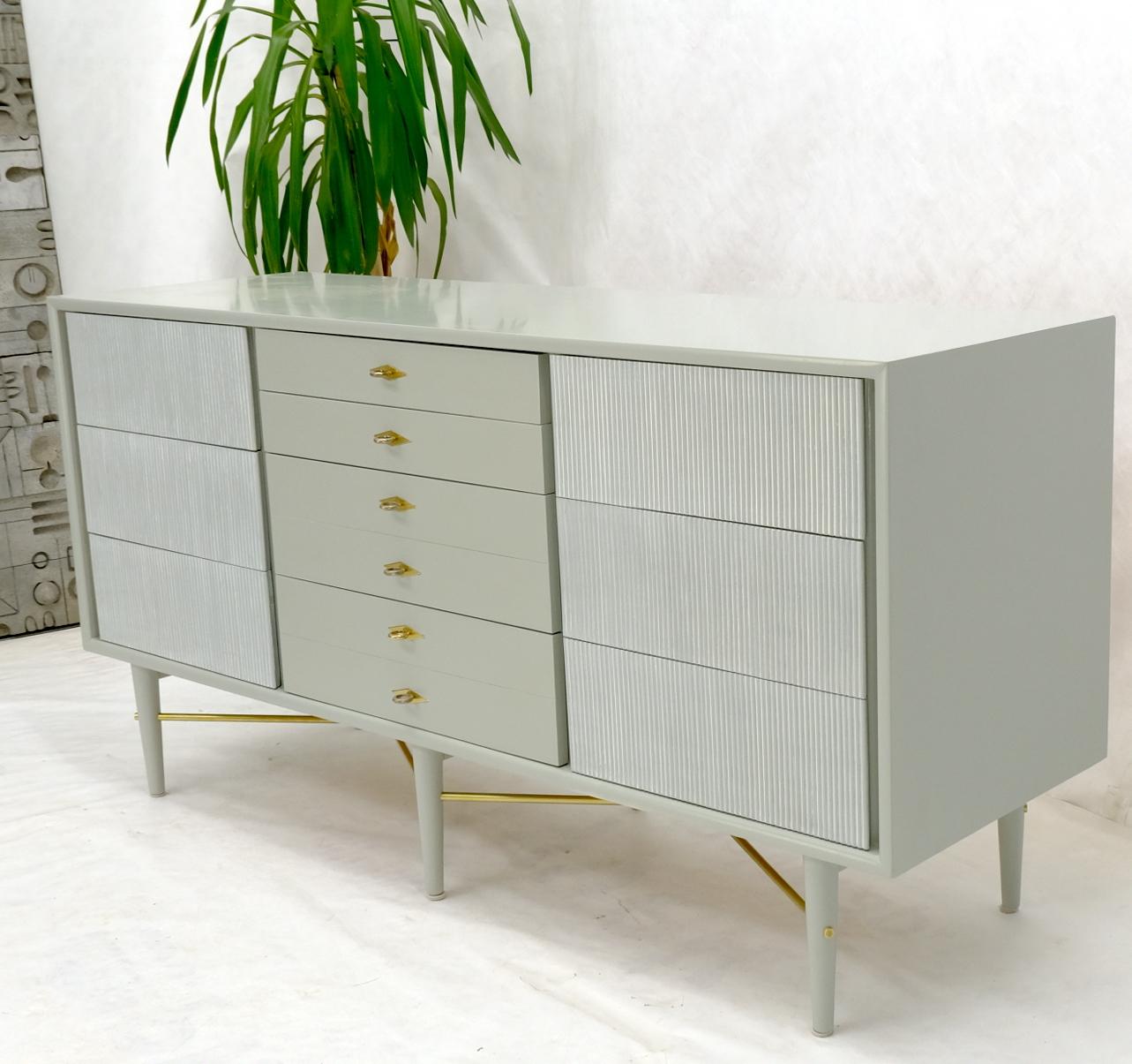 Restored Mid-Century Modern two tone 10 drawers long dresser credenza with brass stretchers and ring pulls.