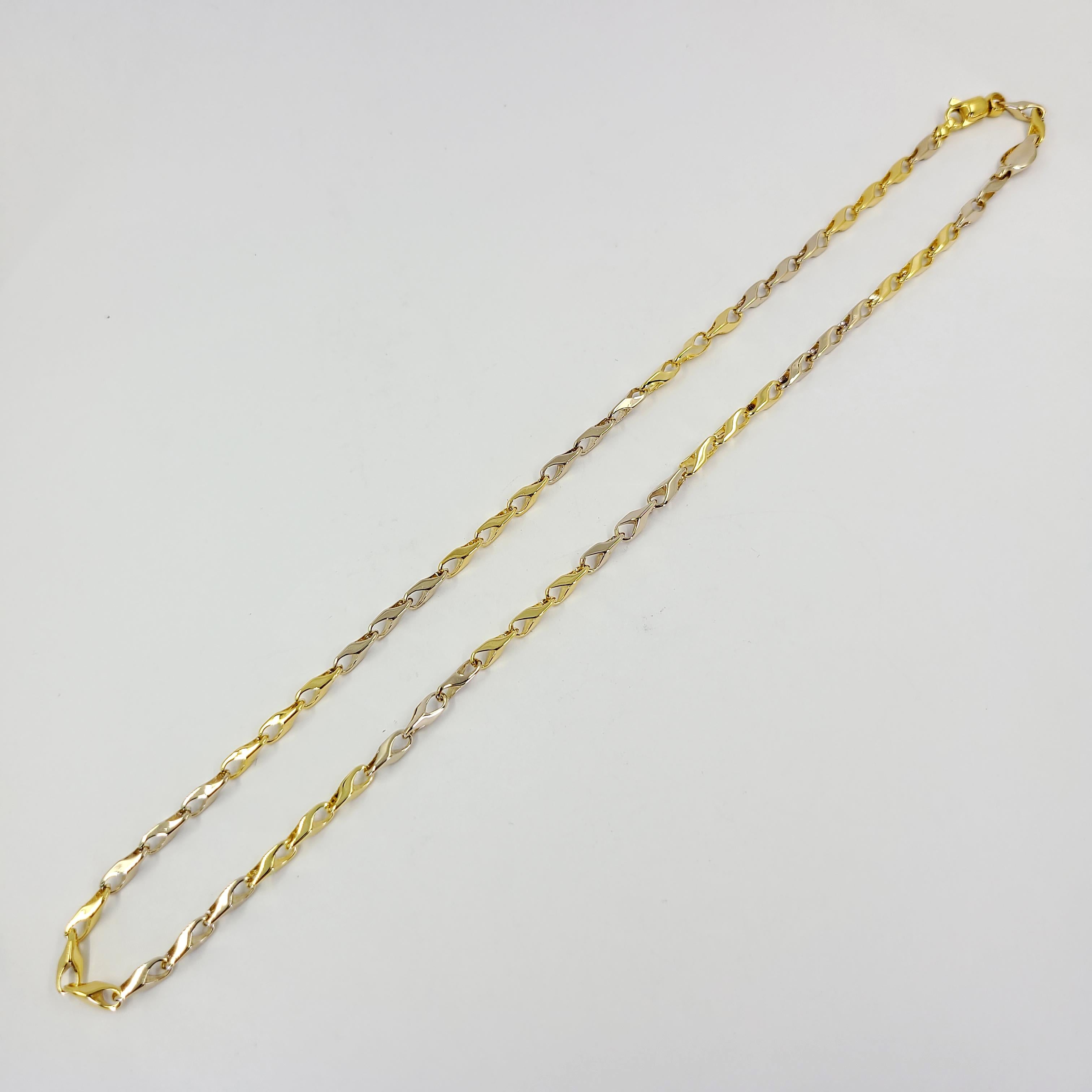 18 Karat White and Yellow Gold Italian High Polish Link Chain Measuring 19 Inches Long with Swiveling Lobster Clasp. Finished Weight Is 26.8 Grams.