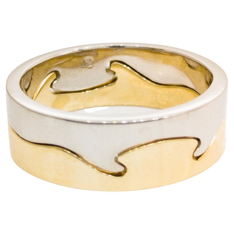 18 carat White and Yellow gold wedding band styled in Georg Jensen FUSION.
Two rings interlock with seamlessly to create the 