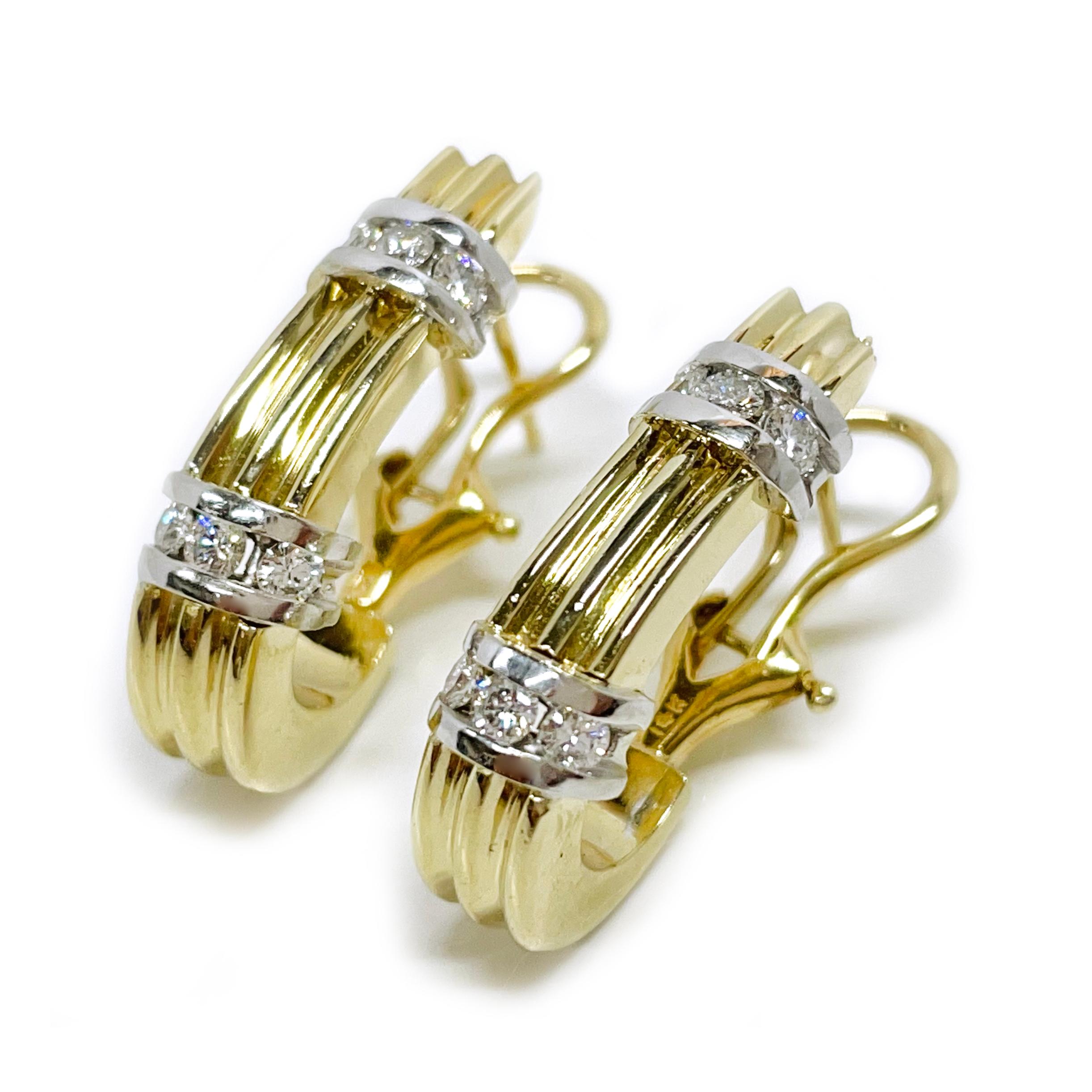 14 Karat Two-Tone Ridged Diamond Earrings. Each earring features ridged semi-hoop (smooth on the inside) and six-round pave-set diamonds in white gold. The diamonds measure 2.5mm for a total carat weight of 0.60ctw. Each earring measures 6.8mm wide