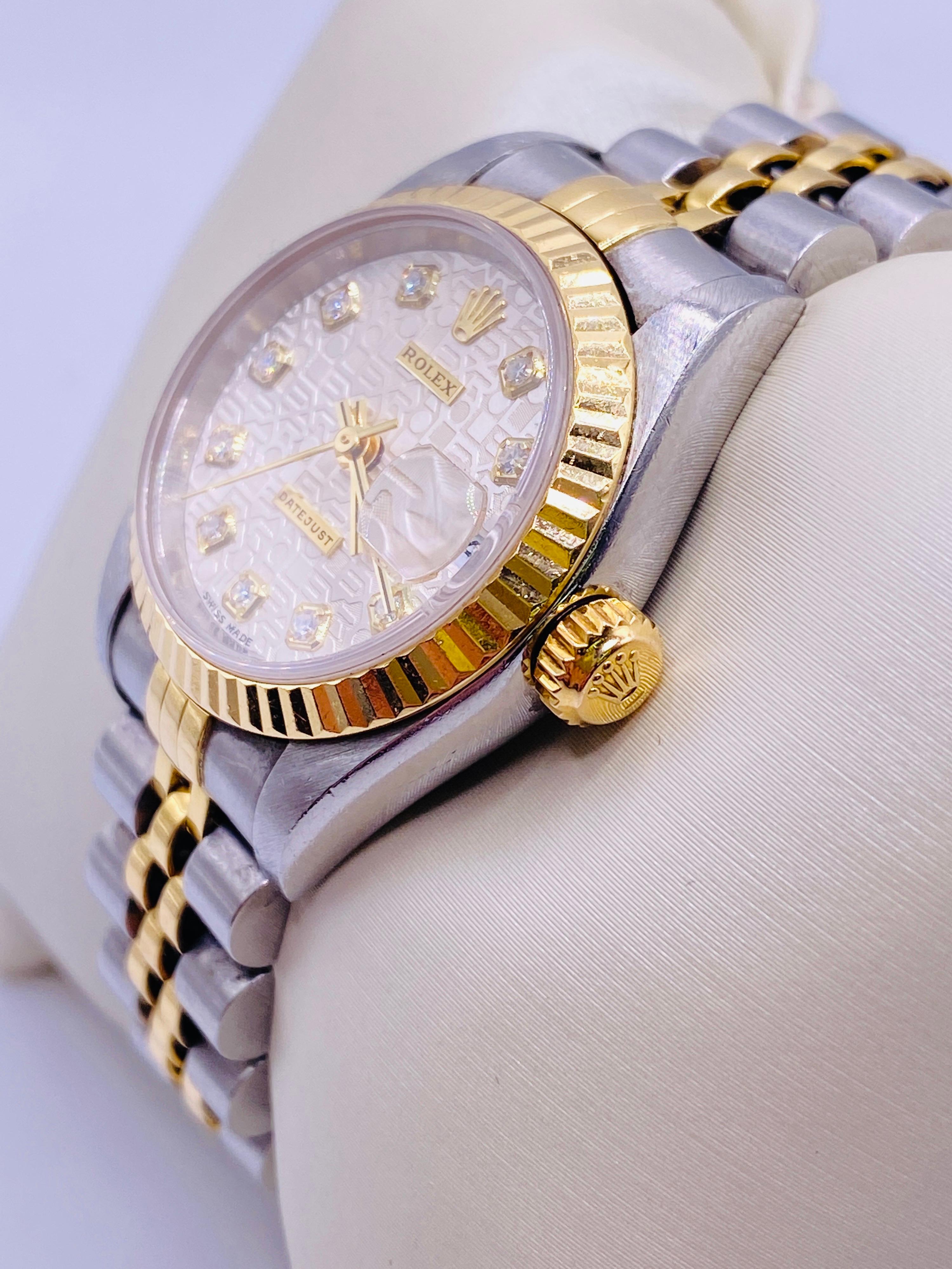 Two-tone 18k yellow gold and stainless steel Rolex Datejust model number 69173 with diamond white color jubilee dial. 26mm case. Box and papers included. SRL# u818816. Circa 1997. No apparent modifications. Fully serviced. 