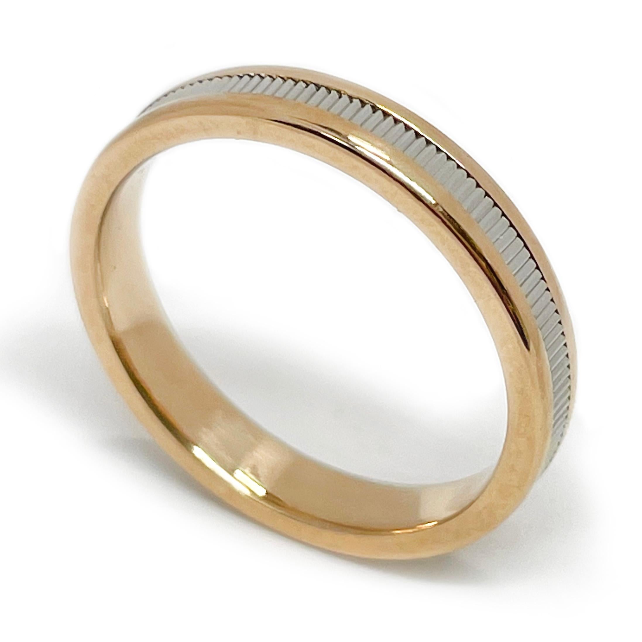 14 Karat Two-Tone Rose Gold Ring Band. The ring features a rose gold base with a smooth shiny finish and a fluted white gold center for added sparkle. Stamped on the inside of the 3.3mm wide band is a designer hallmark, an N inside a heart with an