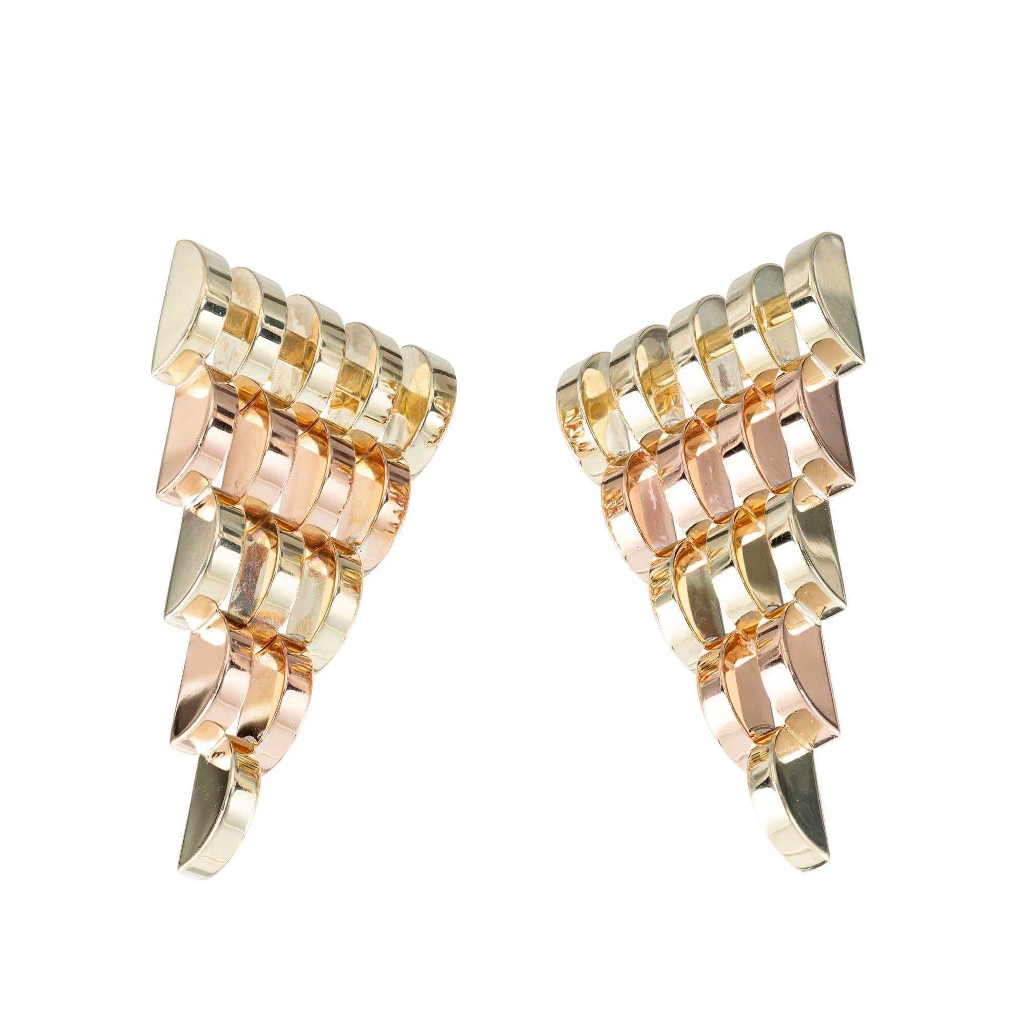 Retro 1940's rose and green gold tapered pierced earrings.

14k rose and green gold
Tested: 14k
Hallmark: 714094
15.8 grams
Top to bottom: 45.14mm or 1.77 inches
Width: 23.65mm or .93 inch
Depth: 5.28mm
