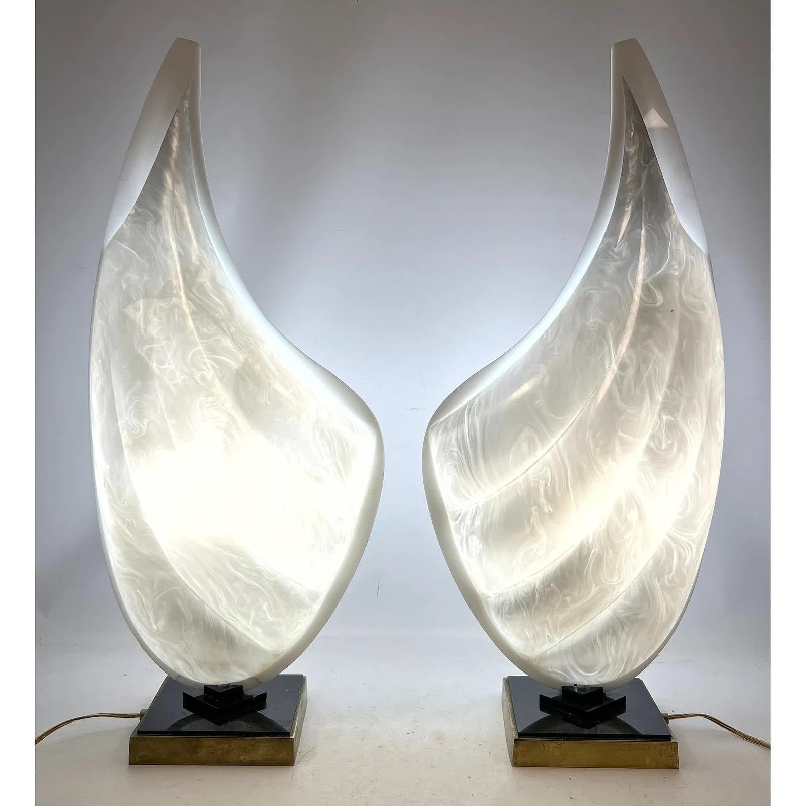 Pair of Rougier acrylic table lamps, made in Canada and dated October 12, 1984. Each lamp features a two-tone clam shell design with one silver side and one white side. A sculptural and distinctive piece from Rougier’s 1980s collection. 