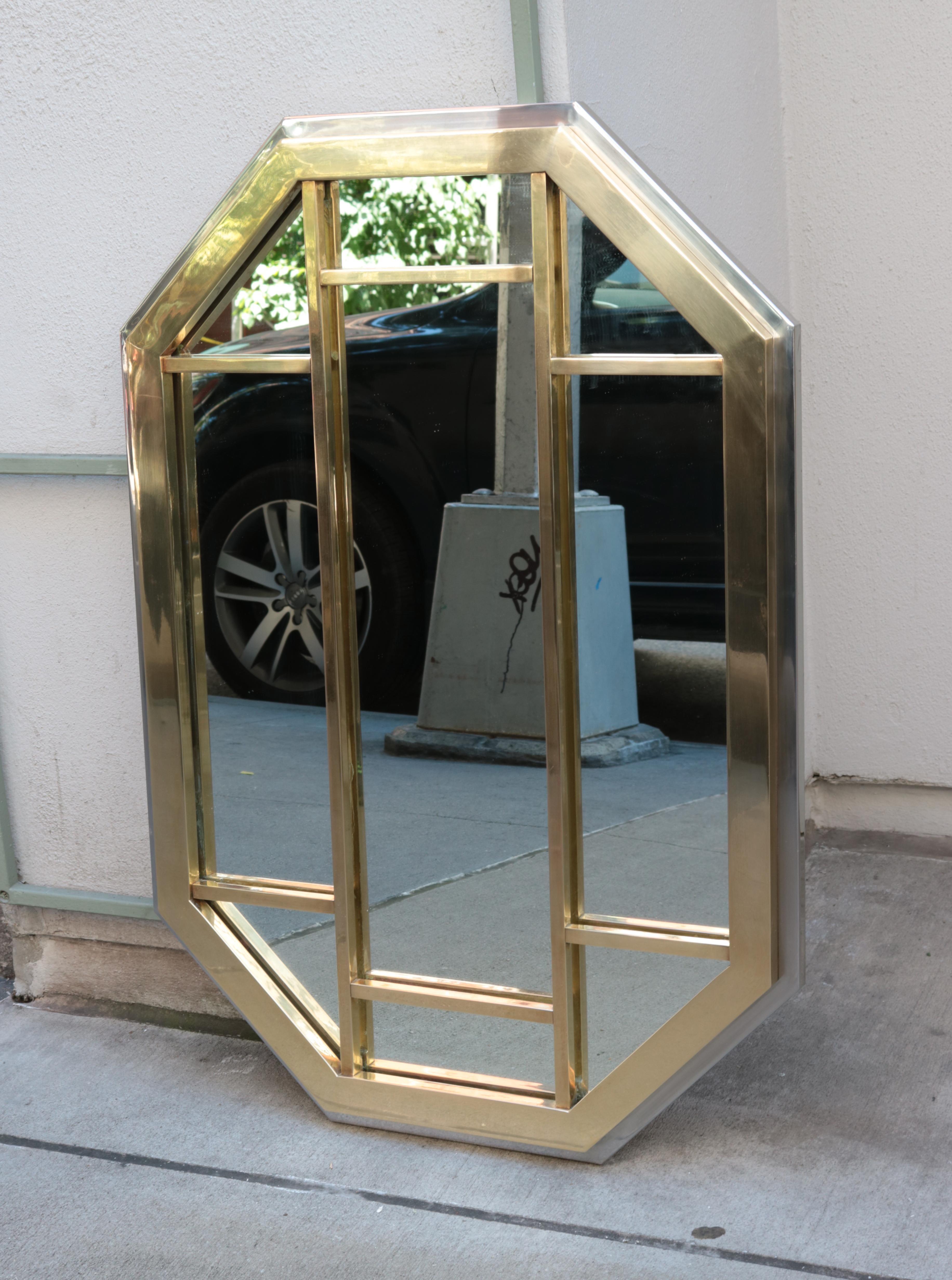 Two-tone segmented modernist mirror.
Chrome and polished brass finishes.