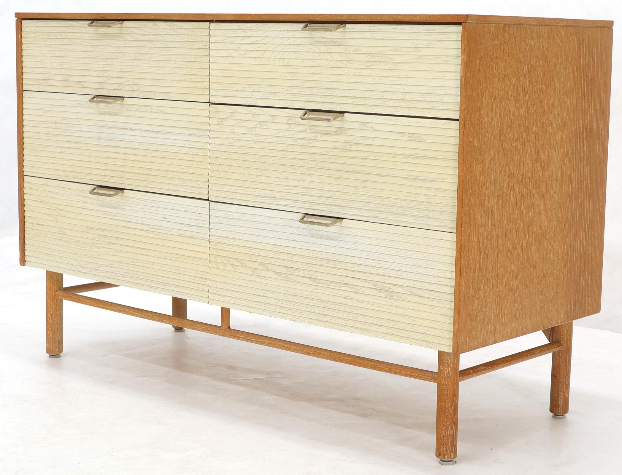 Mid-Century Modern cerused oak 6 drawer dresser by Mengel. Two-tone finish natural oak with white louver shape drawer fronts. Dowel shape legs with stretchers. NYC area delivery starts from $150.