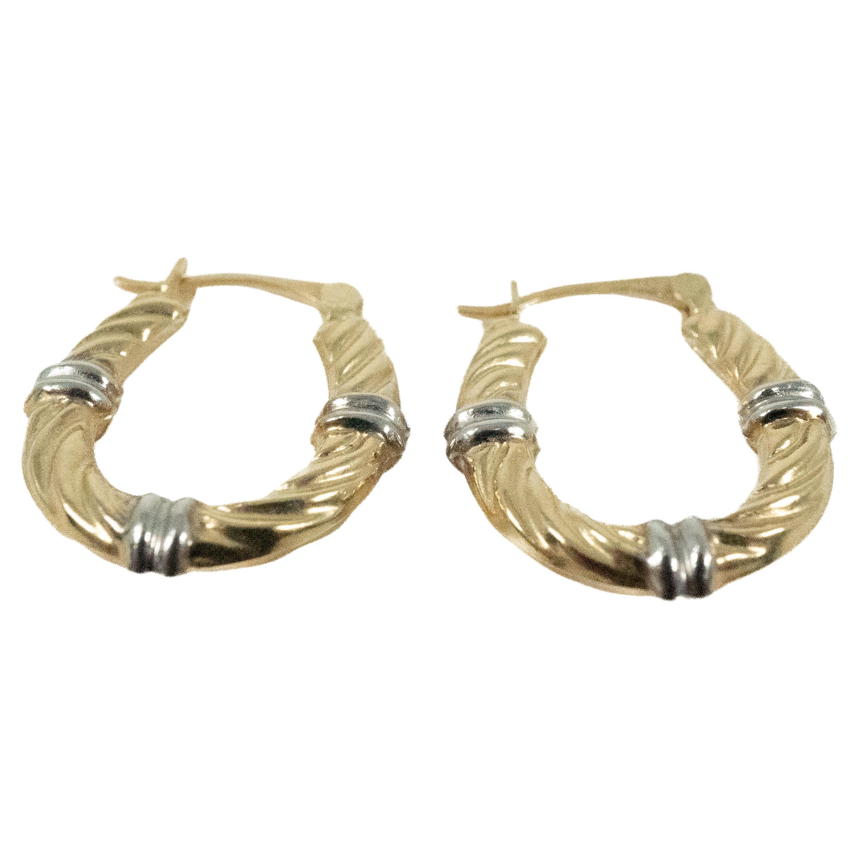 Super versatile two tone hoop earrings in 14 karat gold.  There are light and very comfortable to wear.