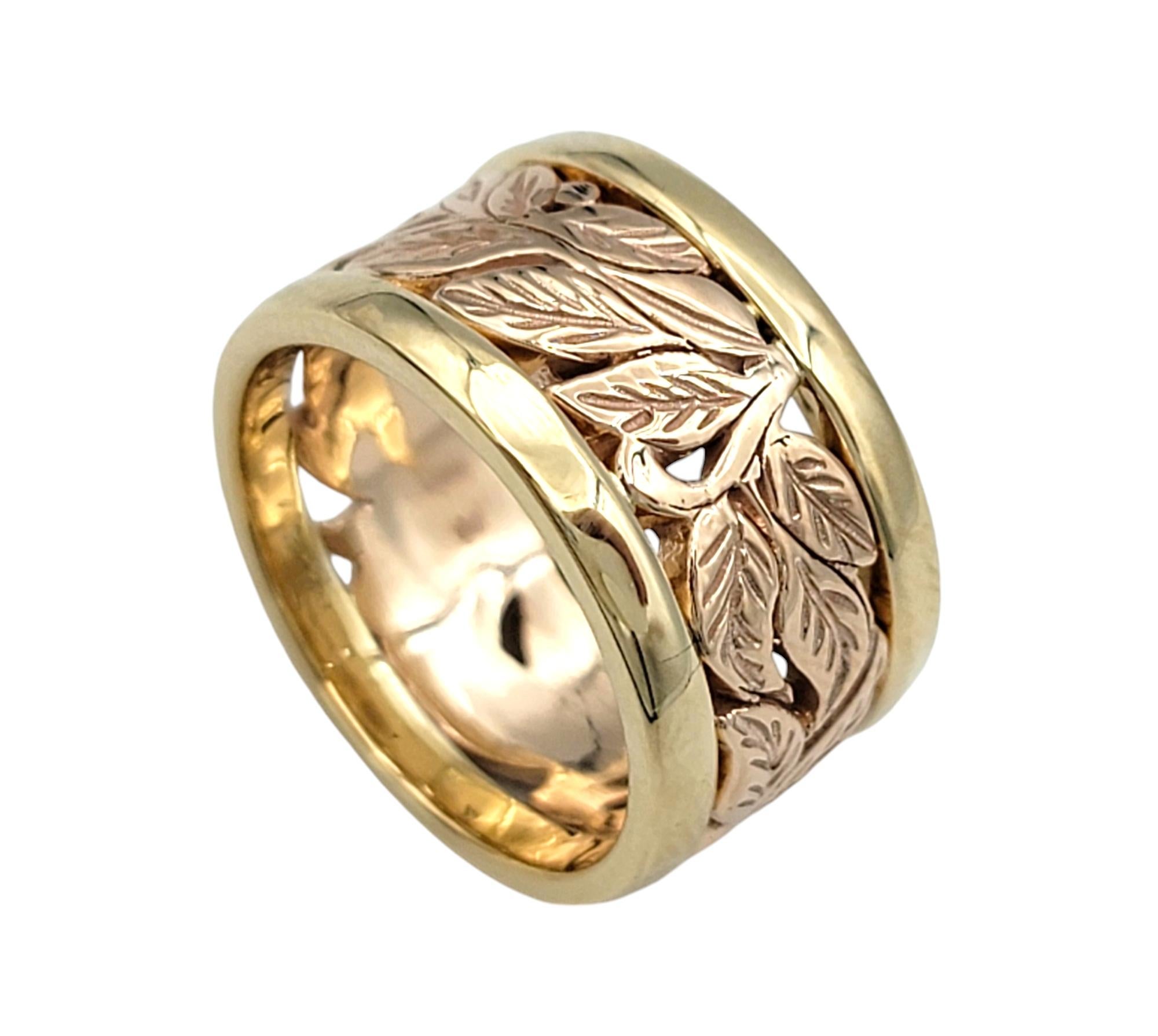 Experience the perfect blend of nature-inspired elegance and luxurious craftsmanship with this exquisite band-style ring. Adorned with delicate 14 karat rose gold leaves that encircle the center of the band, this ring exudes a graceful charm that is