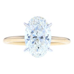Two-Tone Yellow and White Gold Oval Diamond Engagement Ring