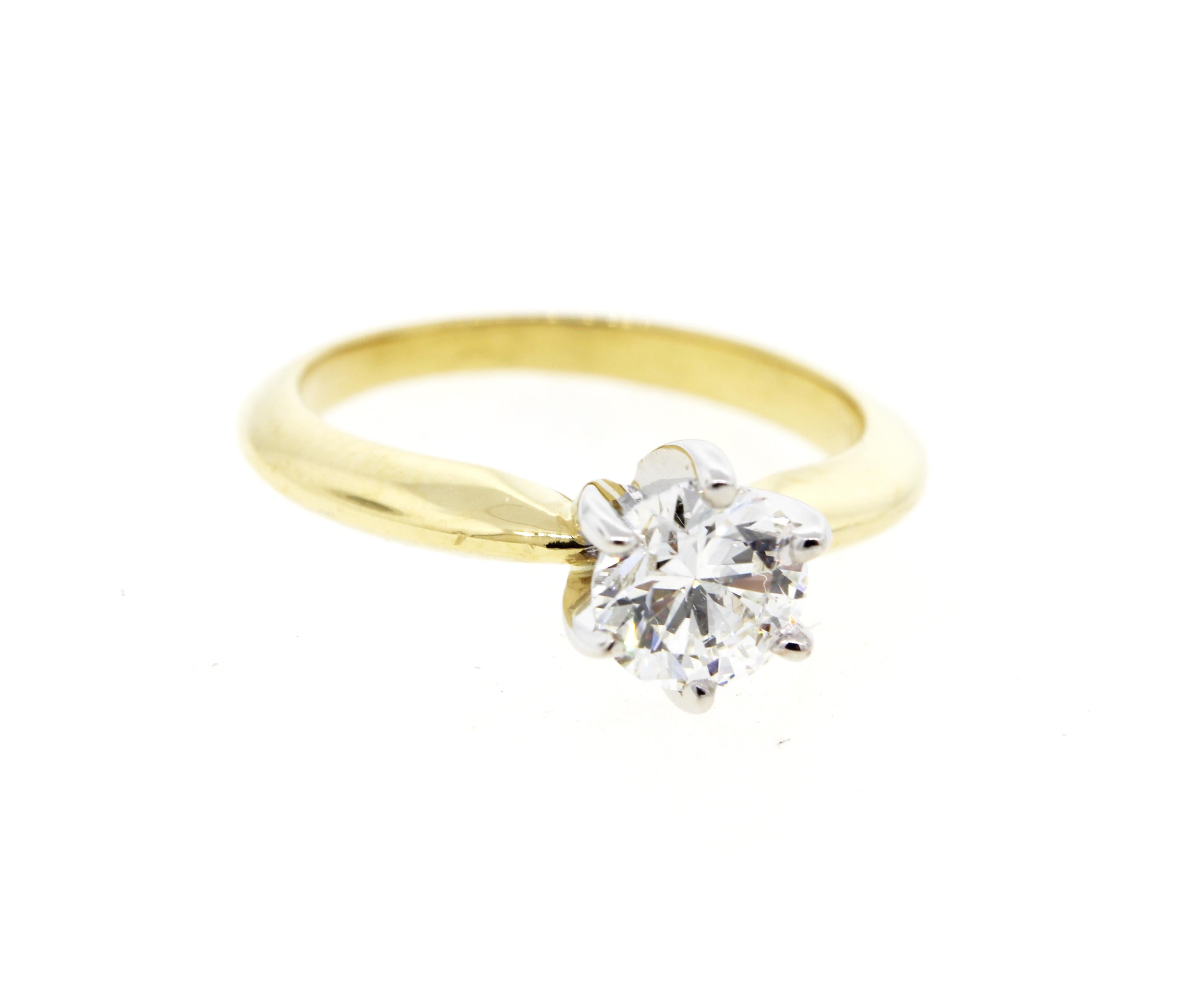 Elegant and classic, this beautiful setting features a surprise two-tone look with a white gold basket. This ring is one of our most popular and most requested rings for good reason! It’s a classic look that combines a two tone yellow gold and white