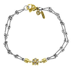 Two-Tone Yellow White Gold and Diamond Chain Bracelet with Flower Cluster