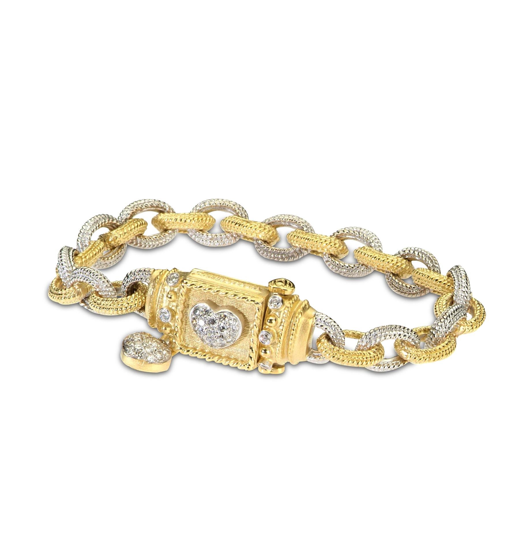 18K Yellow White Two-Tone Gold and Diamond Link Bracelet with Heart Clasp and Dangling Diamond Heart Charm by Stambolian

This staple from the Stambolian collection is a timeless bracelet with unique and original design

The links are alternating