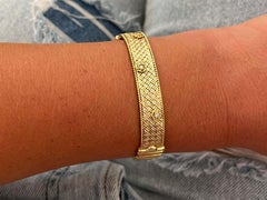 Bracelet bicolore en or 18 carats avec fleur et diamant