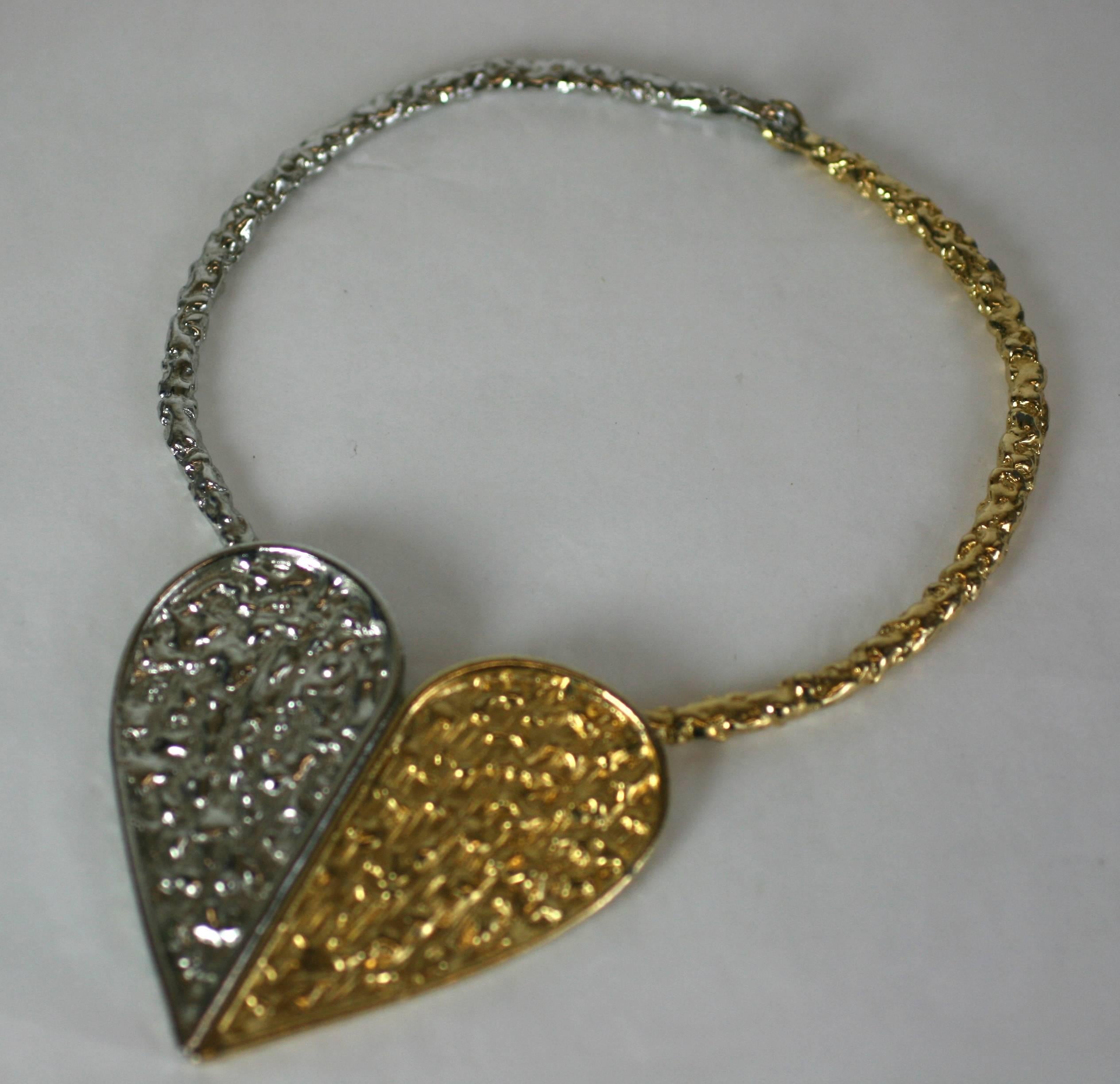 Brutalist Heart Pendant in silver and gold toned metal. Surely Inspired by YSL heart jewelry of the period. 
Designed in the Brutalist style with striking results. 
1970's USA. Heart measures 3