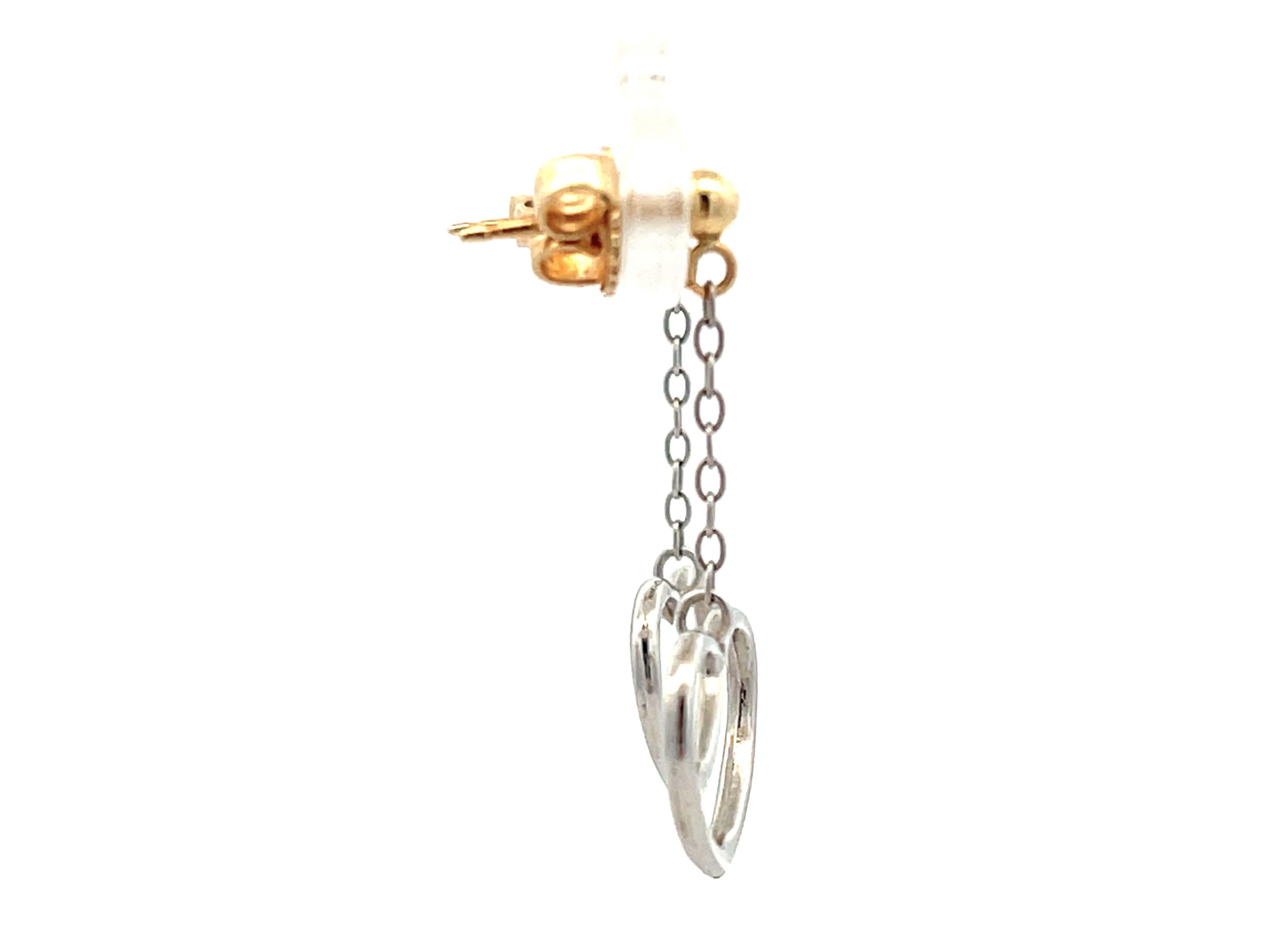 Women's Two Toned Gold Dangly Heart Earrings For Sale