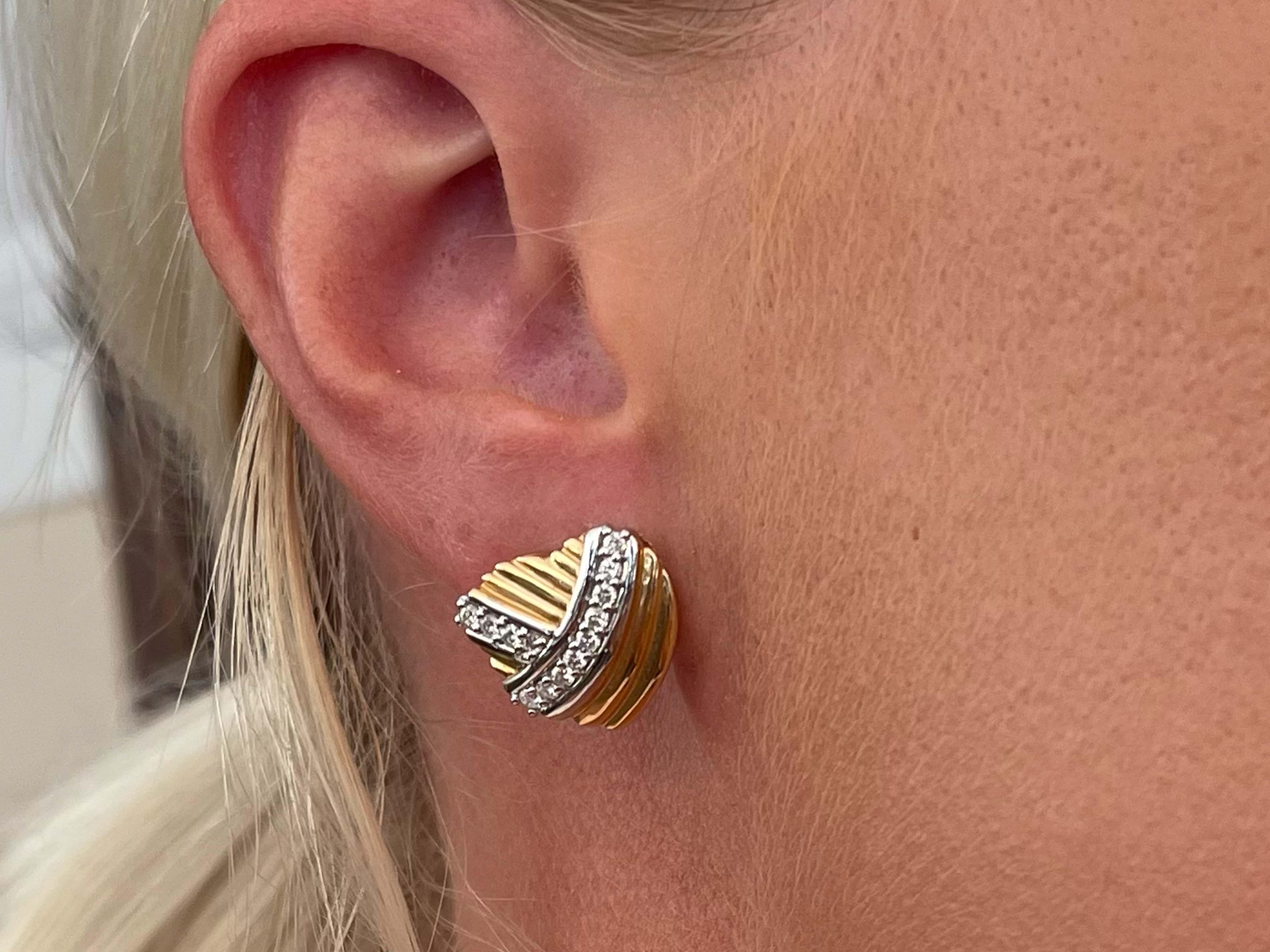 Earrings Specifications:

Metal: 14k White and Yellow Gold

Earring Diameter: 15.5 mm

Total Weight: 7.4 Grams

Diamonds: 26

Setting: Prong

Diamond Color: G

Diamond Clarity: VS

Diamond Carat Weight: 0.50 carats

Condition: Preowned

