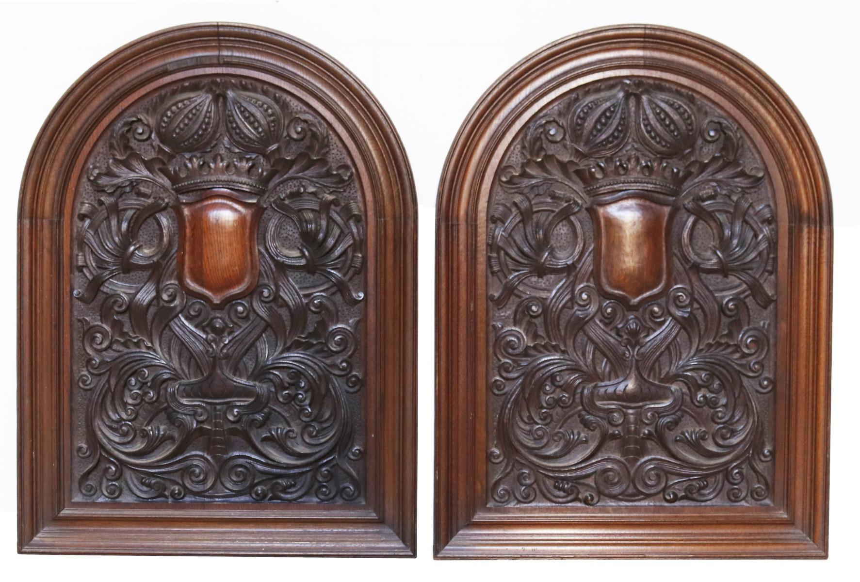 A pair of finely carved oak wall panels, each containing a shield centre, surround by scrolling foliage and fruits.

Additional Dimensions (each)

78.5 x 58 x 4.5 cm.